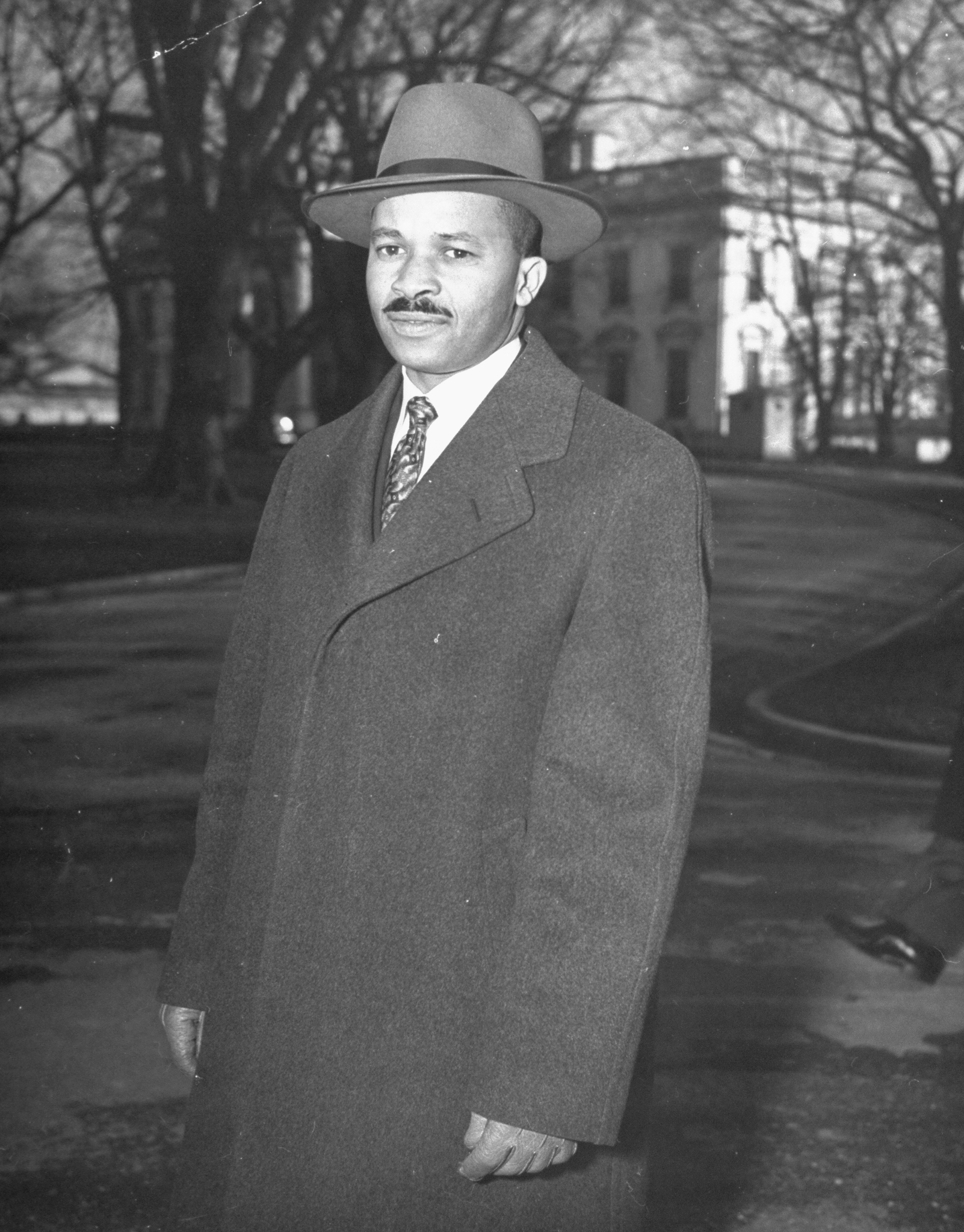 Reporter Harry McAlpin leaving the White House after a press conference in 1944. (George Skadding&mdash;Time &amp; Life Pictures/Getty Image)