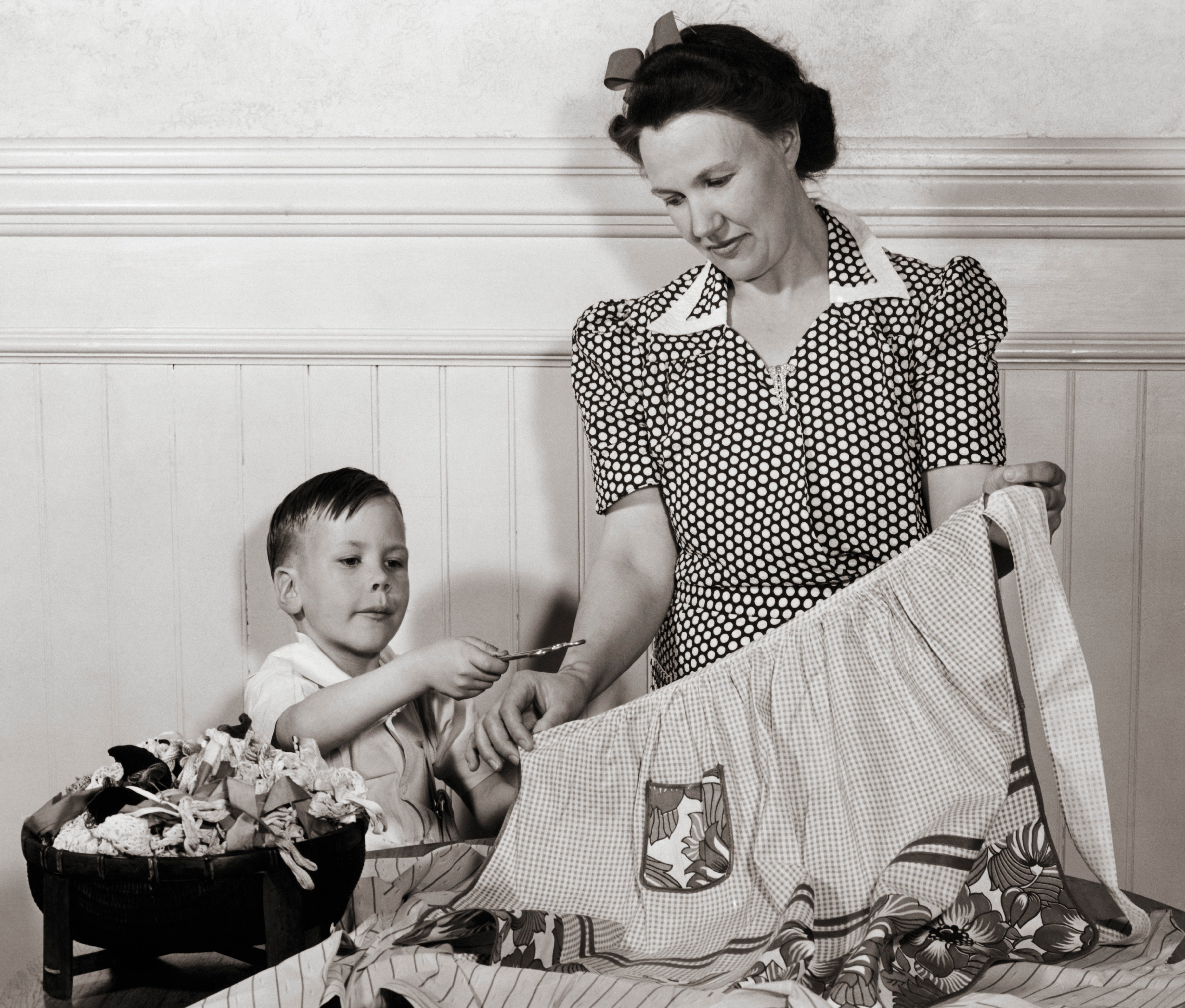 Boy Helping Mother with Laundry (Vintage Images&mdash;www.jupiterimages.com)