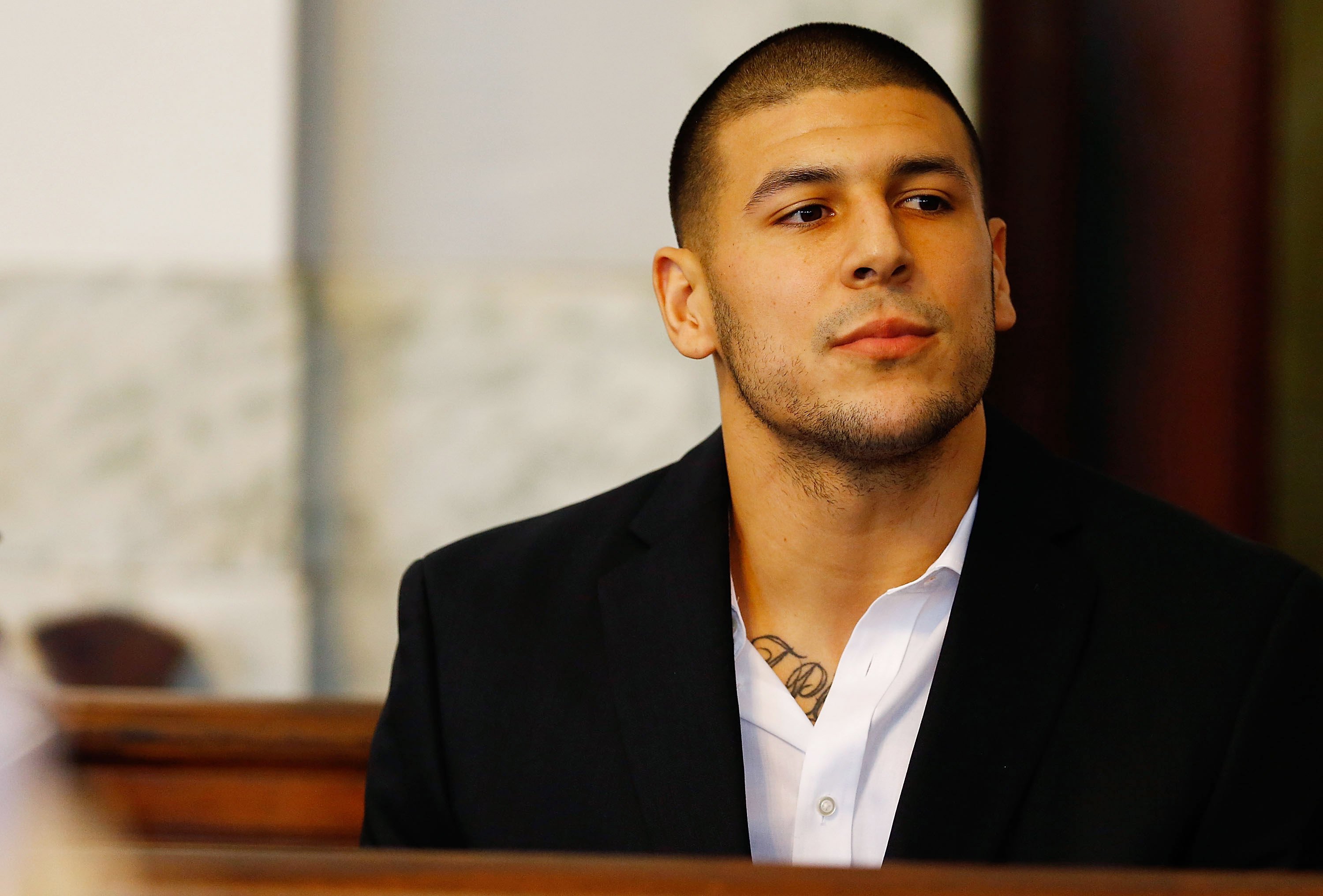 Aaron Hernandez sits in the courtroom of the Attleboro District Court during his hearing on Aug. 22, 2013 in North Attleboro, Mass. (Jared Wickerham—Getty Images)