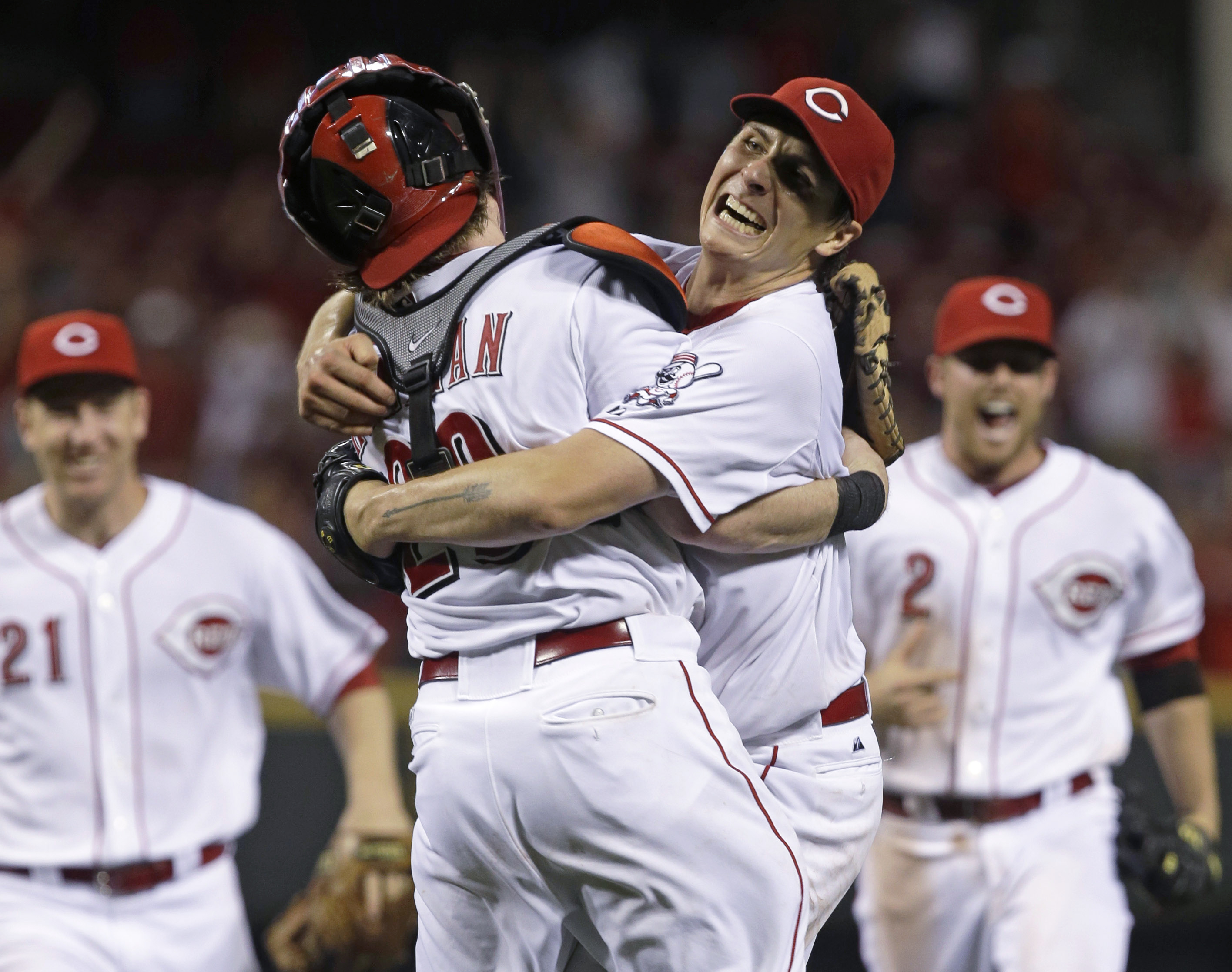 Cincinnati Reds starting pitcher Homer Bailey, right, hugs catcher Ryan Hanigan, left, after Bailey threw a no-hitter against the San Francisco Giants in a baseball game, Tuesday, July 2, 2013, in Cincinnati.