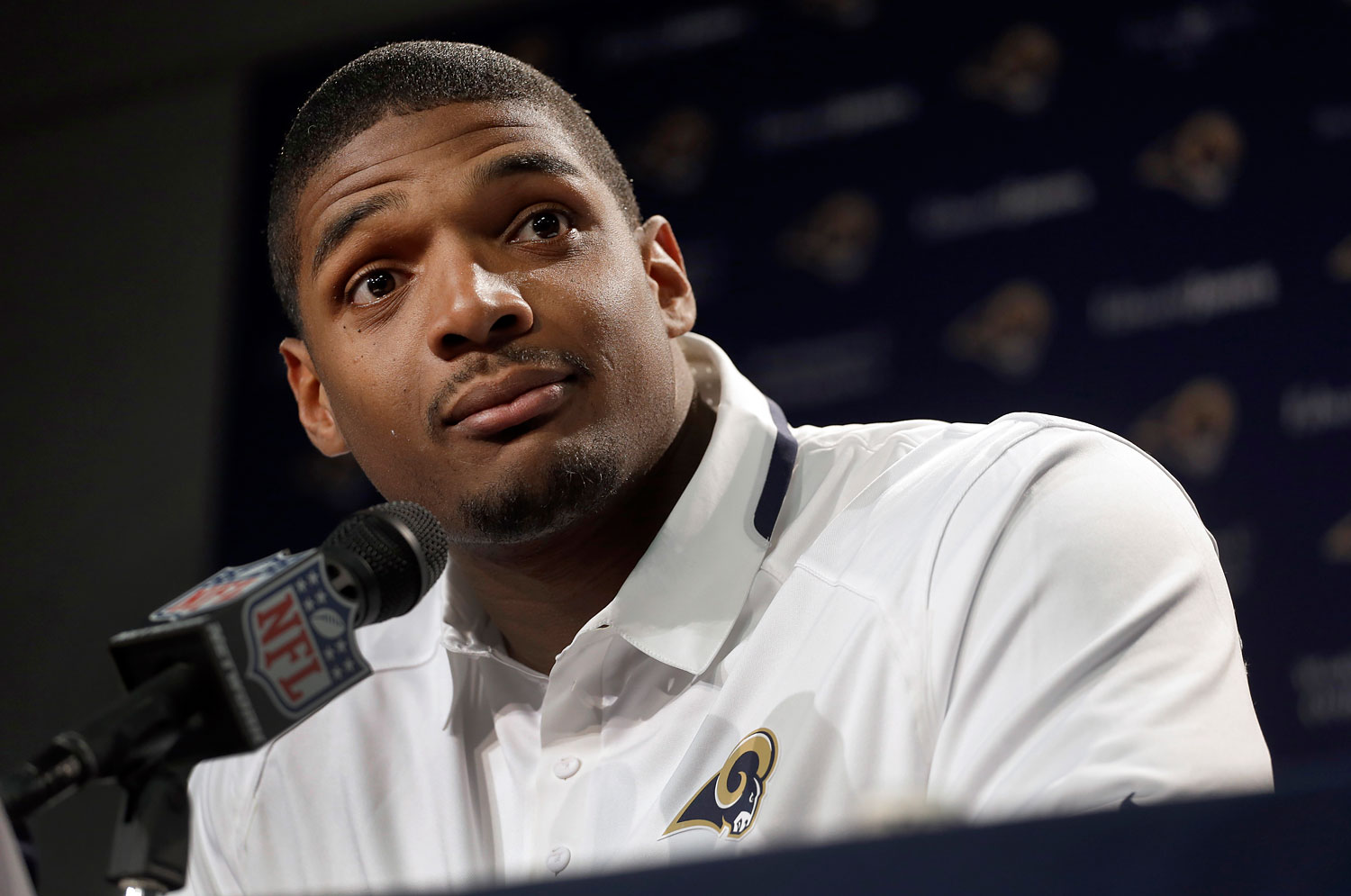 St. Louis Rams seventh-round draft pick Michael Sam listens to a question during a news conference at the NFL football team's practice facility, May 13, 2014, in St. Louis. (Jeff Roberson—AP)