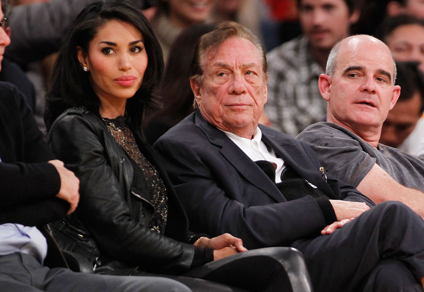 Los Angeles Clippers owner Donald Sterling, center, and V. Stiviano, left, watch the Clippers play the Los Angeles Lakers during an NBA preseason basketball game in Los Angeles, Dec. 19, 2010. (Danny Moloshok—AP)