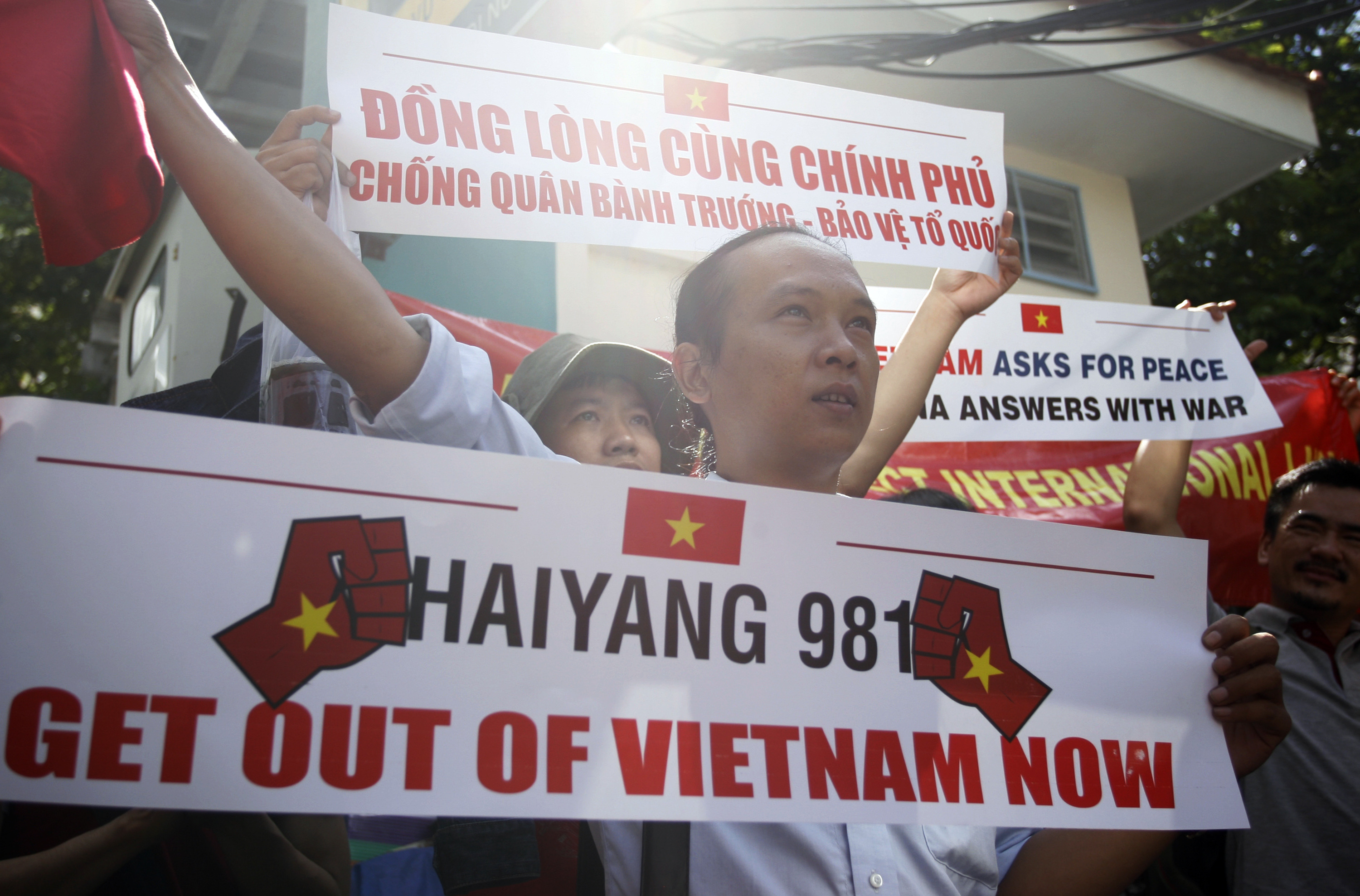 Vietnamese protest against China’s deployment of an oil rig in the disputed South China Sea in front of the Chinese Consulate in Ho Chi Minh City on Saturday, May 10, 2014. (Associated Press)