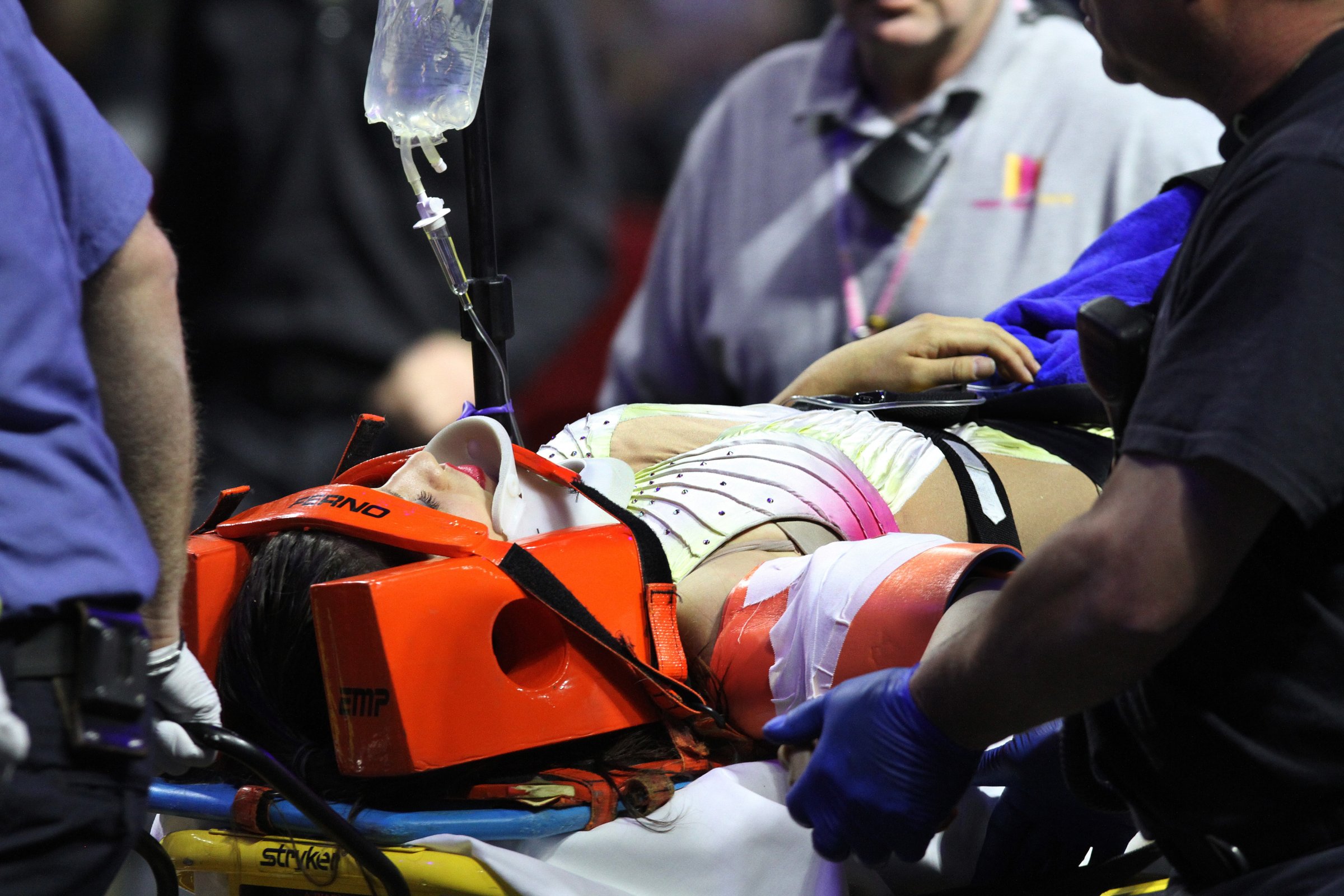 An injured female performer is lifted onto a stretcher and is taken out of the building at the Ringling Brothers and Barnum and Bailey Circus, May 4, 2014, in Providence, R.I.