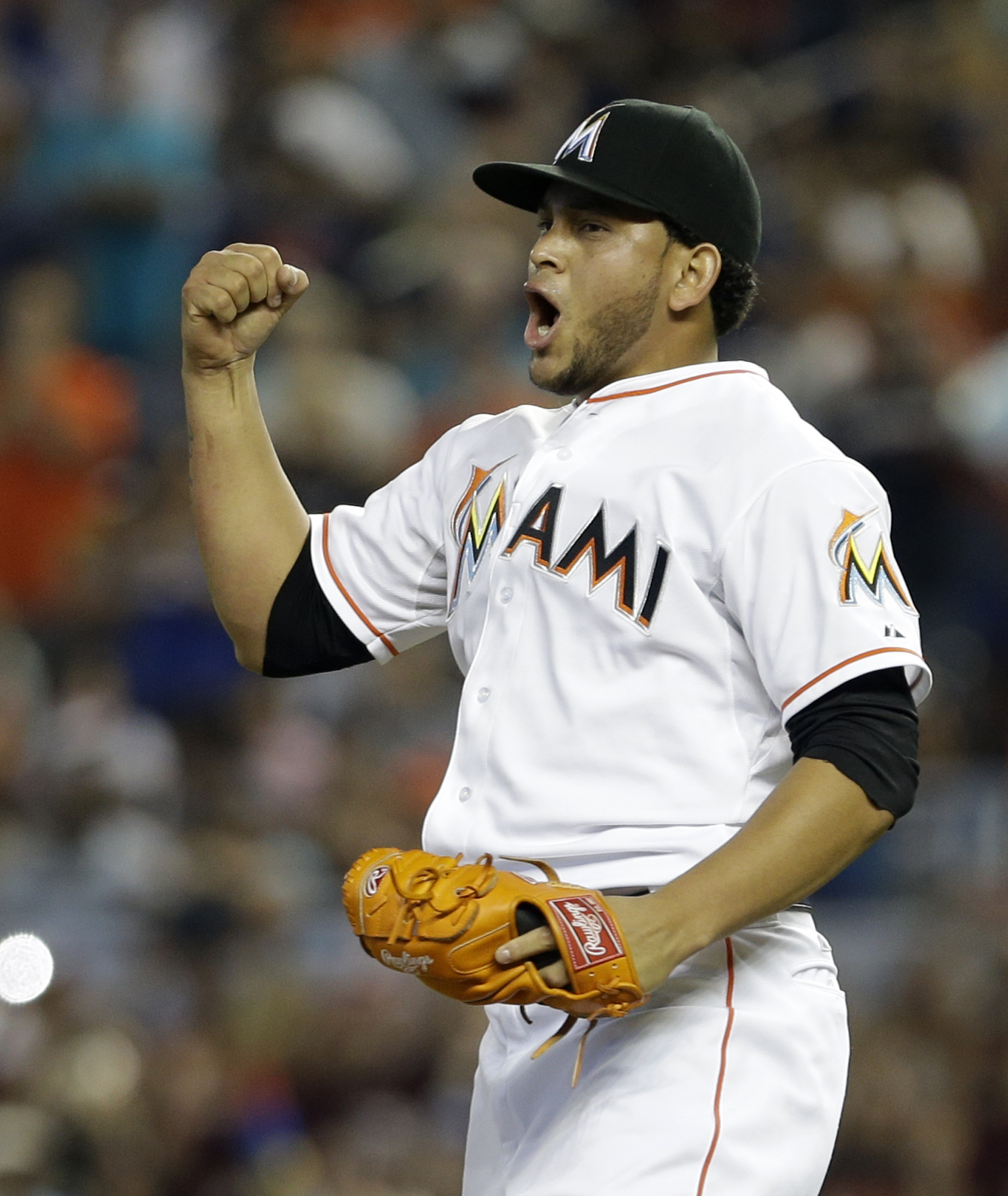 Miami Marlins' Henderson Alvarez celebrates  after striking out Detroit Tigers' Matt Tuiasosopo for the last out of his no-hitter, Sunday, Sept. 29, 2013, in Miami.
