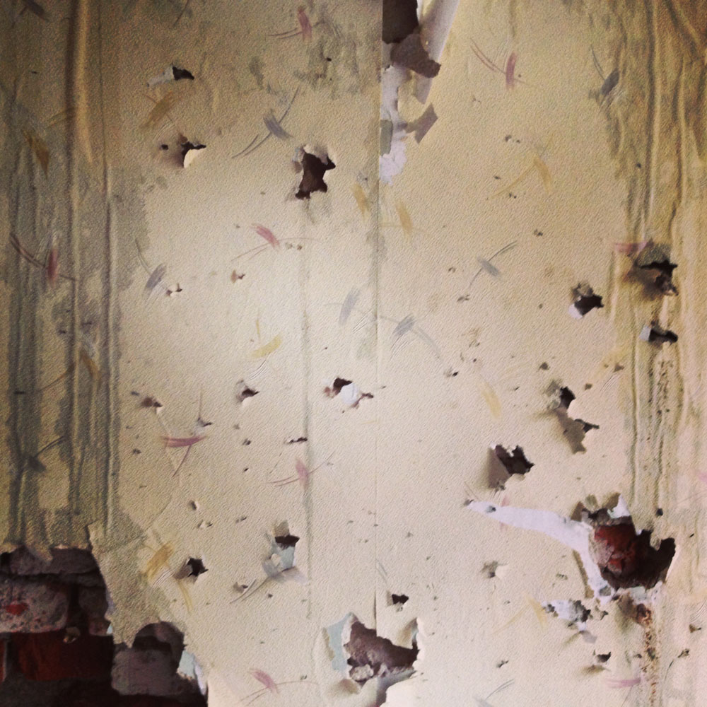 May 9, 2014. Bullet holes mark the wall inside a police station which was attacked and burned in Mariupol, Ukraine.