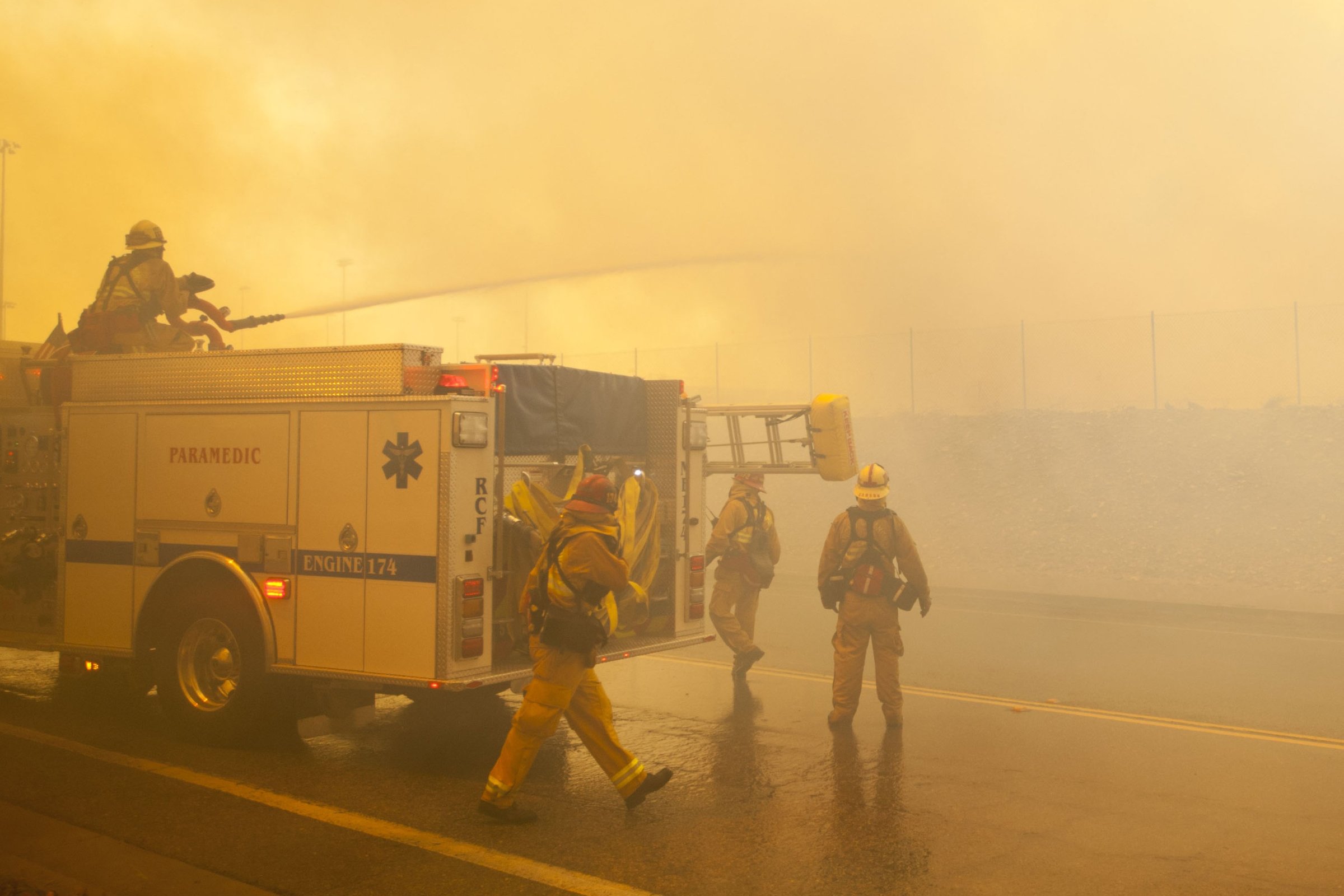 A fire crew uses their deck gun to cut down an aggressive branch of the Etiwanda Fire in Rancho Cucamonga, Calif., on April 30, 2014.