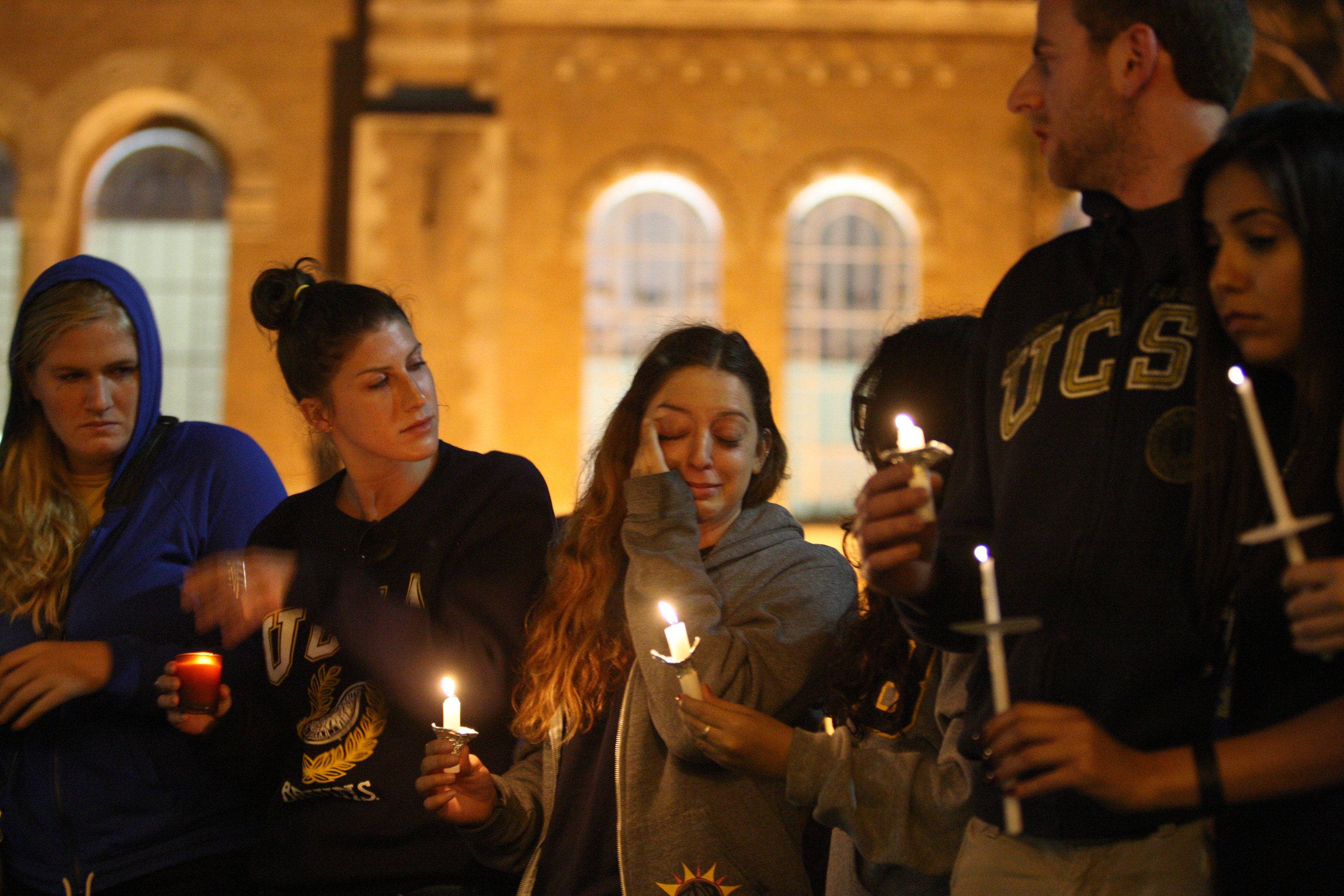 Students of UCSB and UCLA mourn at a candlelight vigil at UCLA for the victims of a killing rampage over the weekend near UCSB on May 26, 2014 in Los Angeles, Calif. (David McNew—Getty Images)