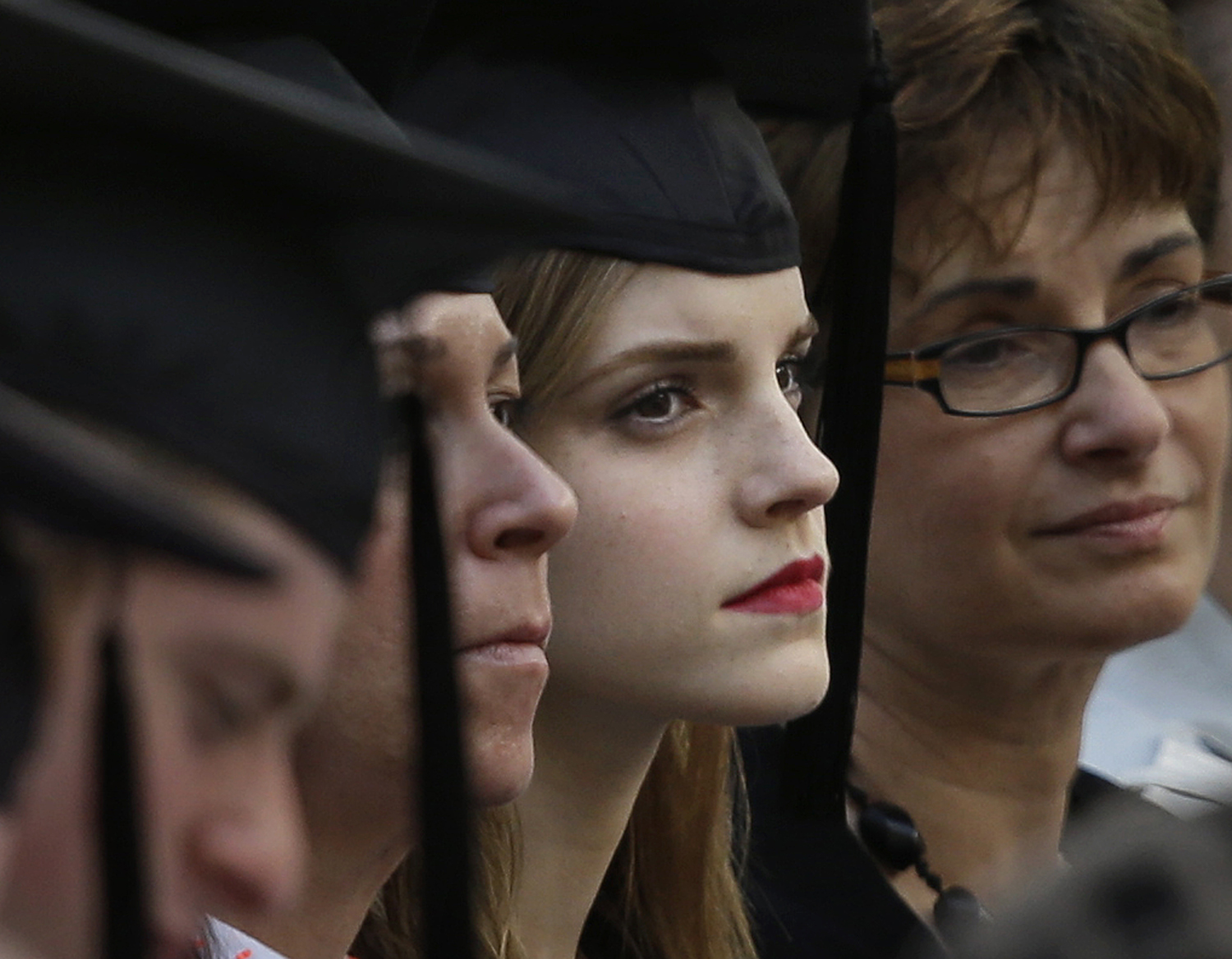 Actress Emma Watson, center right, attends commencement services on the campus of Brown University in Providence, R.I., on May 25, 2014 (Steven Senne—AP)