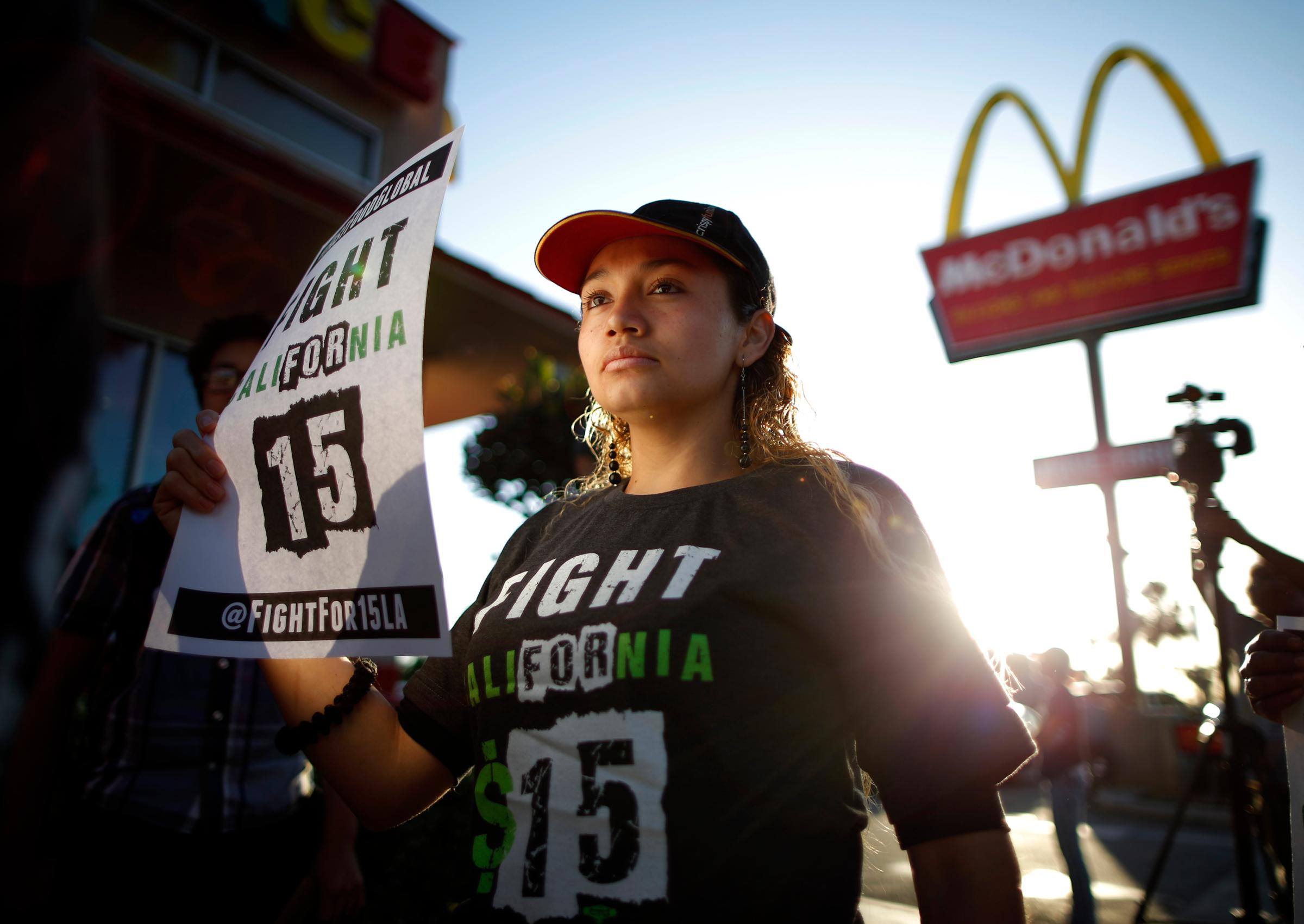 Demonstrators take part in a protest to demand higher wages for fast-food workers outside McDonald's in Los Angeles, on May 15, 2014.