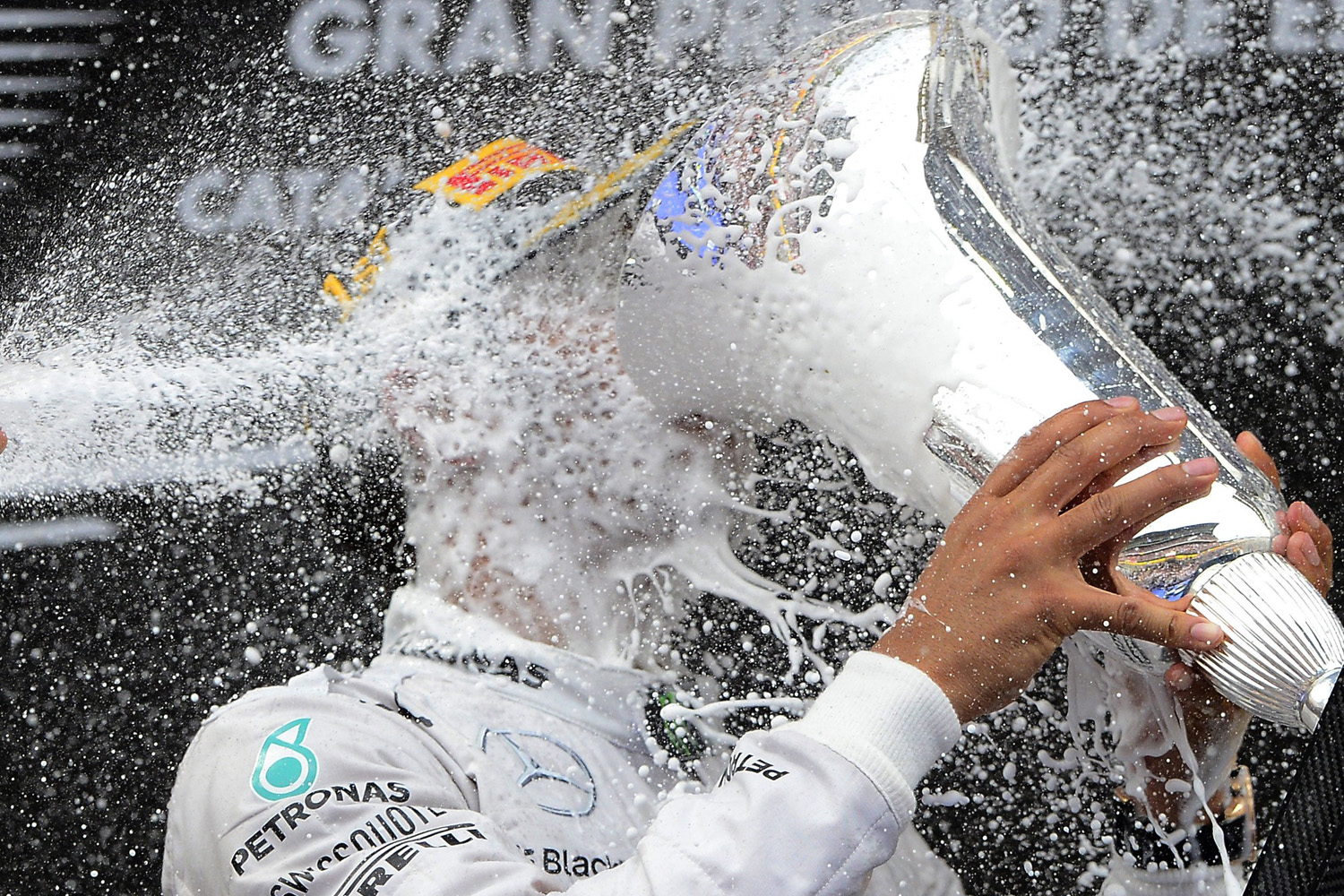Mercedes driver Lewis Hamilton of Britain celebrates on the podium after winning the Spain Formula One Grand Prix at the Barcelona Catalunya racetrack in Montmelo, near Barcelona, Spain, on May 11, 2014.