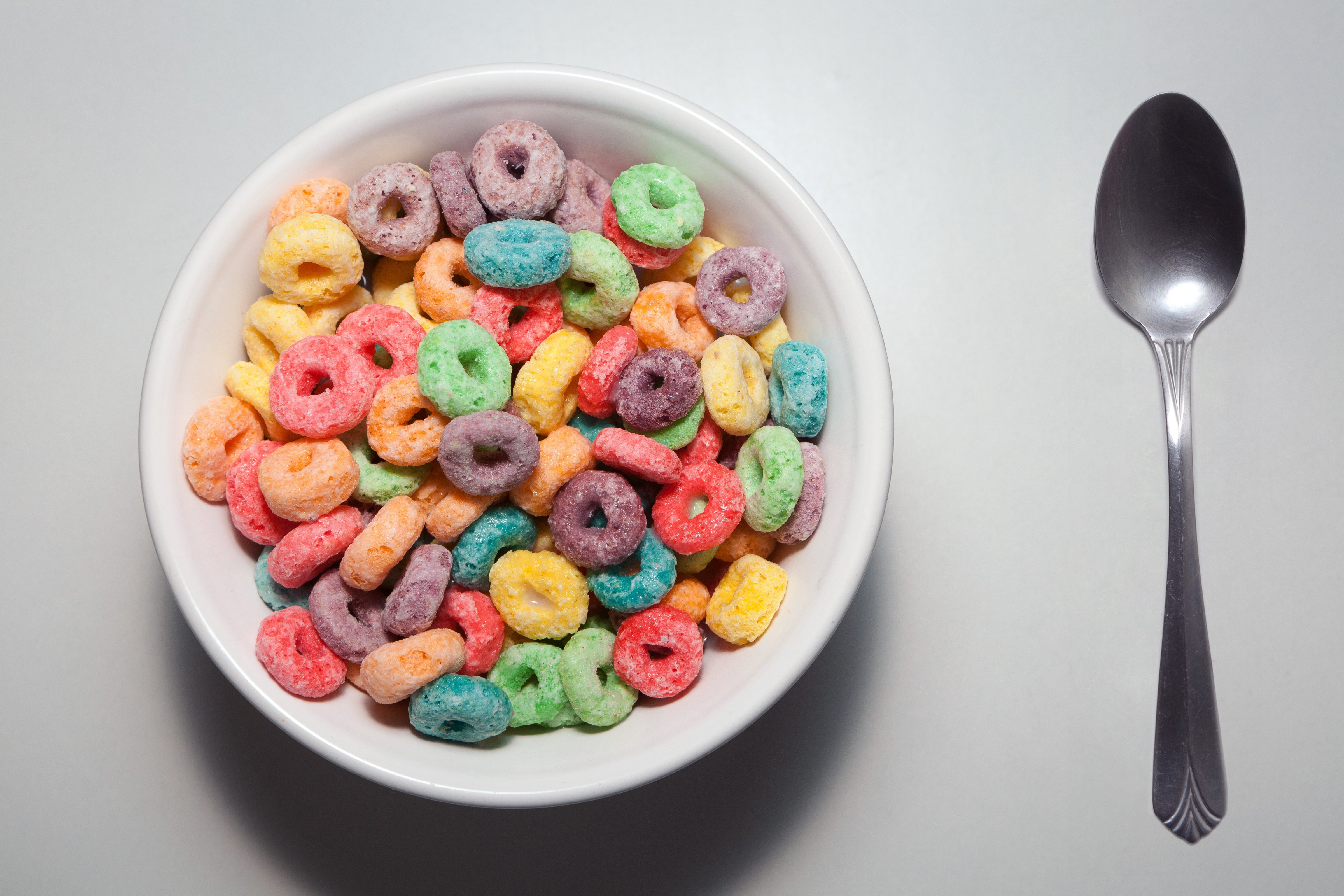 Bowl of colorful breakfast cereal with spoon