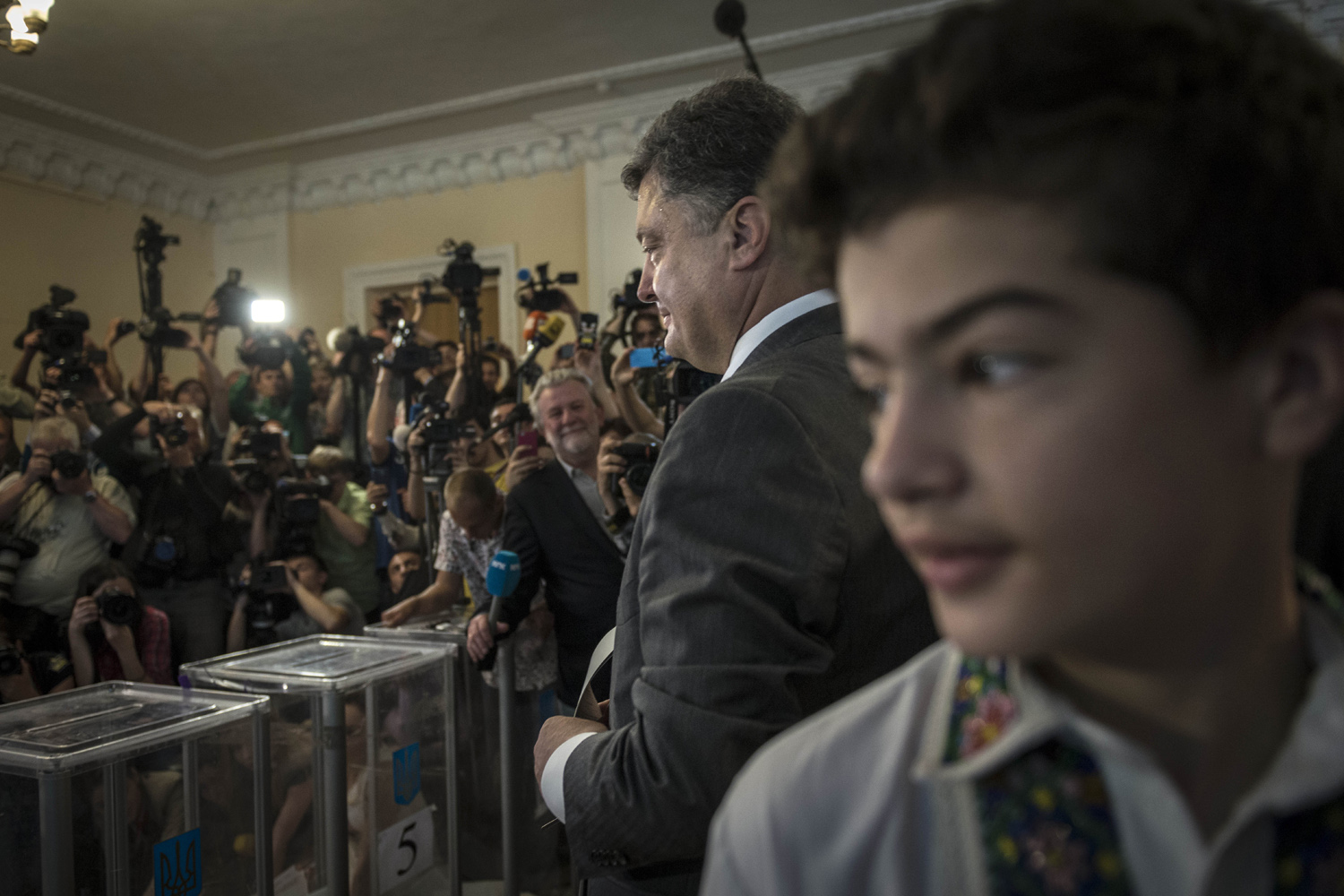 May 25, 2014. Billionaire Petro Poroshenko, accompanied by his son Olexiy, right, casts his ballot in Kiev, Ukraine.