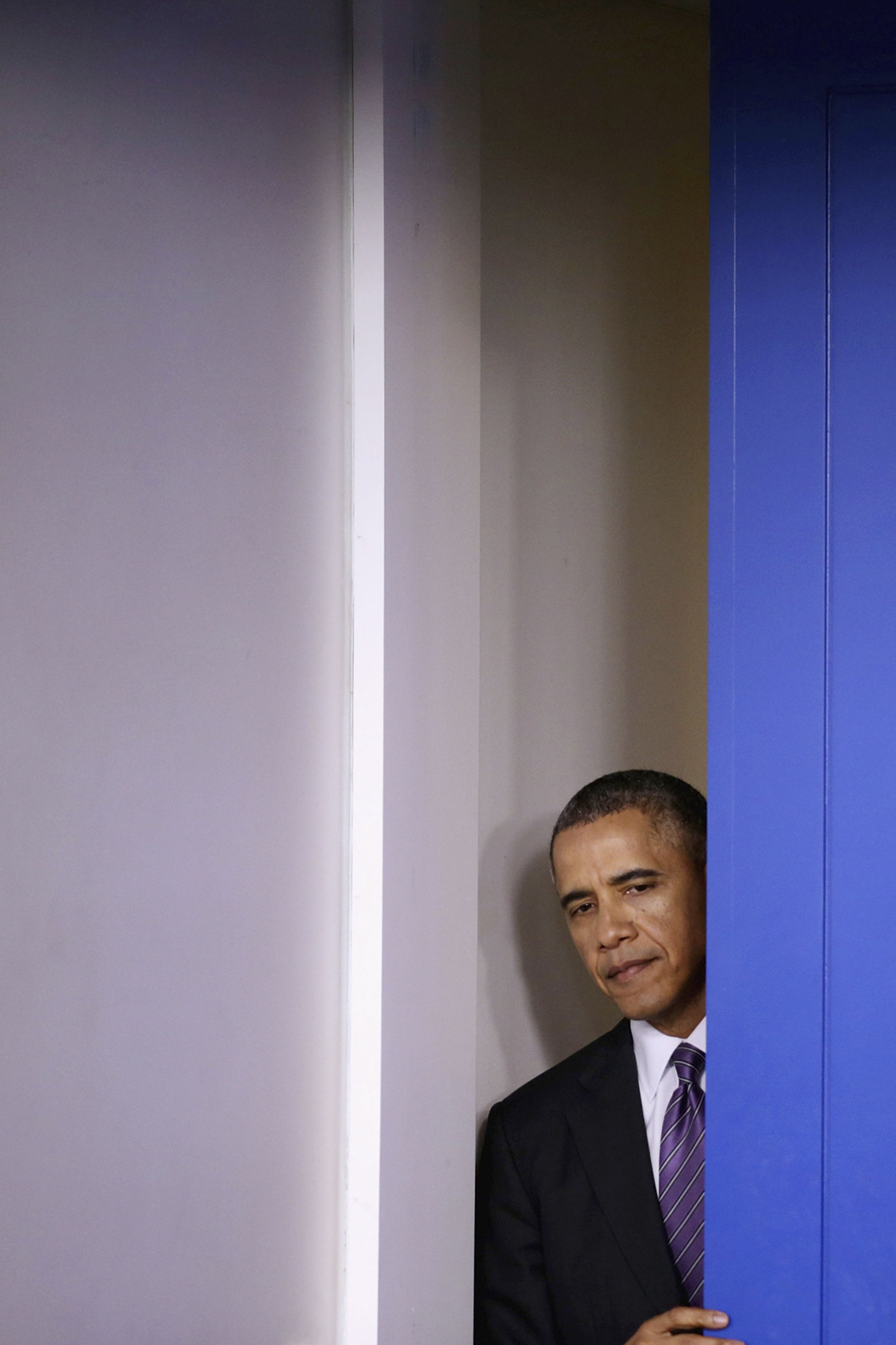 Cowering?  
                      Obama is under fire from the right for being reluctant to act overseas (Chip Somodevilla—Getty Images)
