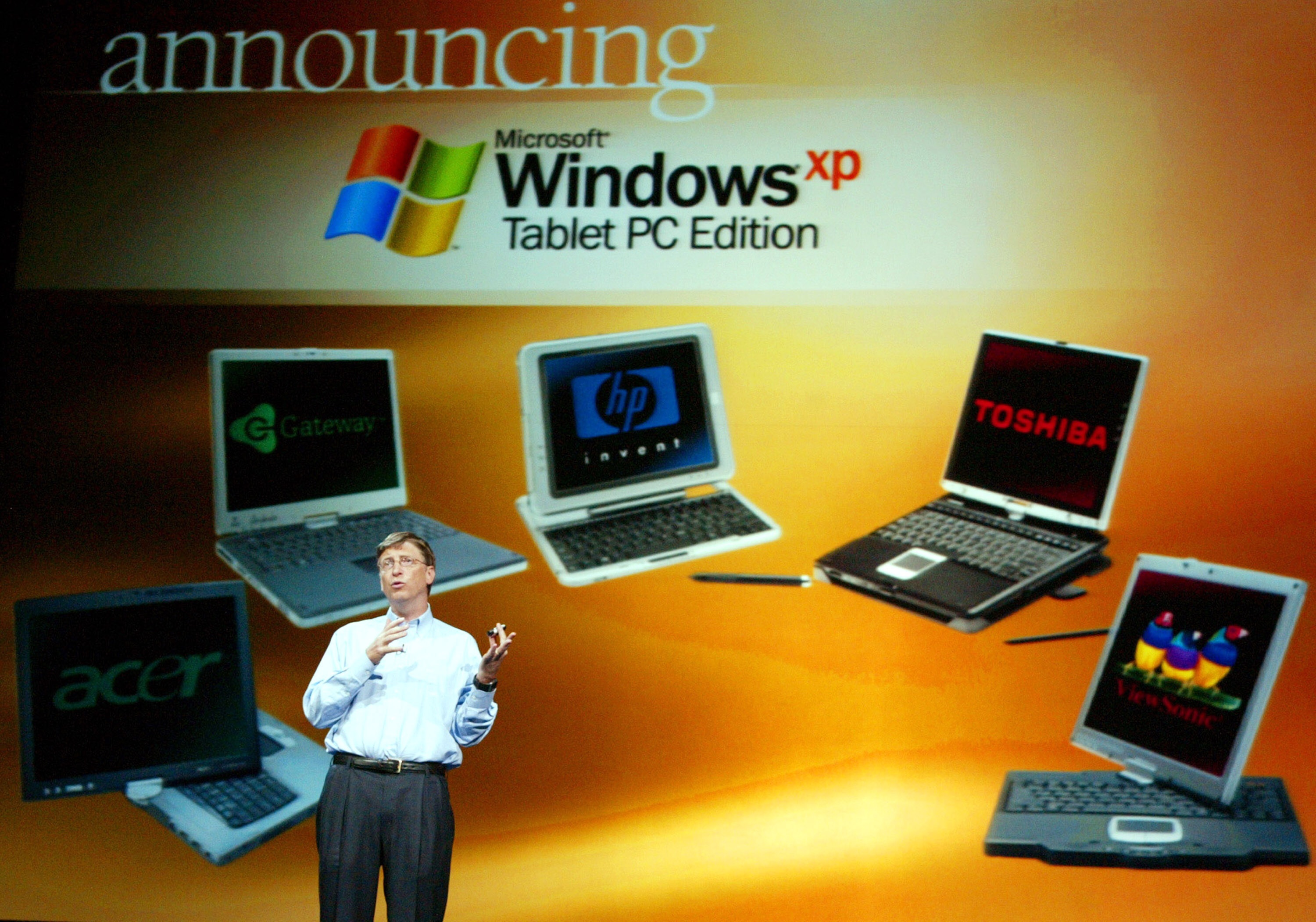Bill Gates shows off Tablet PCs at COMDEX in Las Vegas on November 16, 2003 (Jeff Christensen / WireImage / Getty Images)