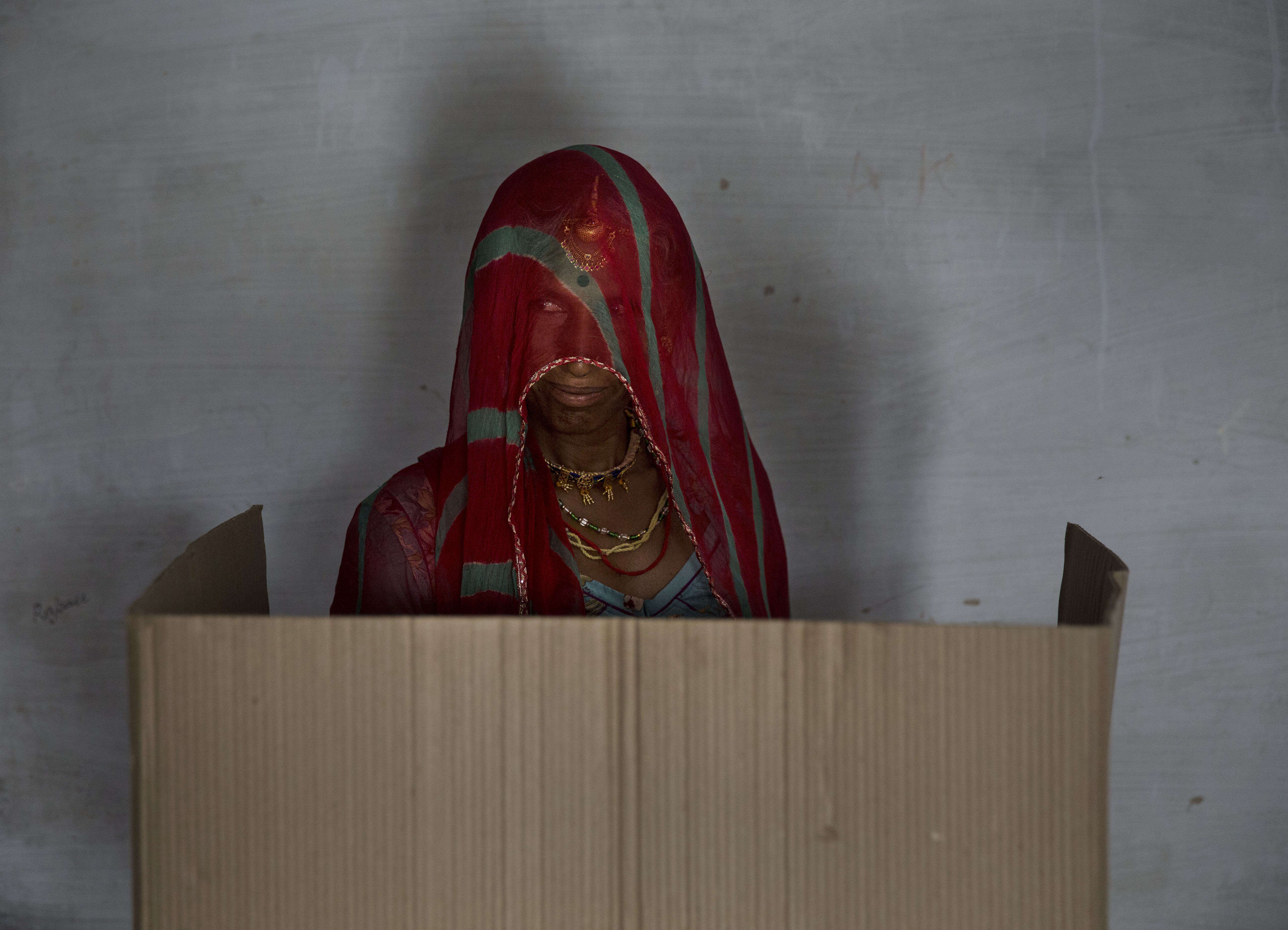 A woman casts her ballot at a polling station on April 17, 2014 in the Jodhpur District in the desert state of Rajasthan.