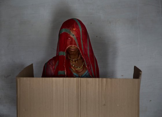 An Indian woman casts her ballot at a polling station on April 17, 2014 in the Jodhpur District in the desert state of Rajasthan.