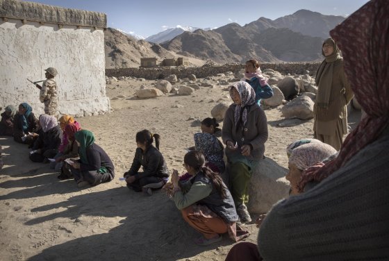 Ladkahis wait outside a polling station to vote near the Thiksey Monastery on May 7, 2014 in Thiksey, Ladakh.