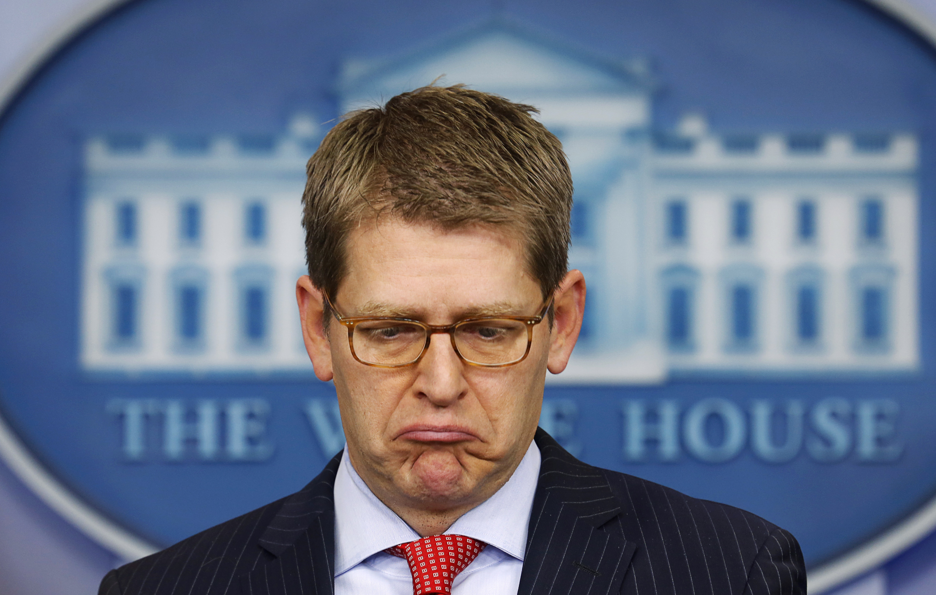 White House press secretary Jay Carney looks down as he speaks to reporters about the so-called  sequester  at the White House in Washington Feb.28, 2013.