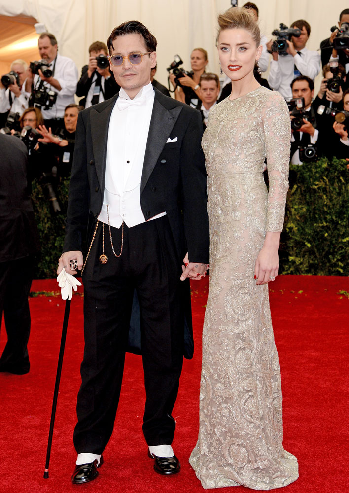 From left: Johnny Depp and Amber Heard attend The Metropolitan Museum of Art's Costume Institute benefit gala celebrating "Charles James: Beyond Fashion" on May 5, 2014, in New York City.