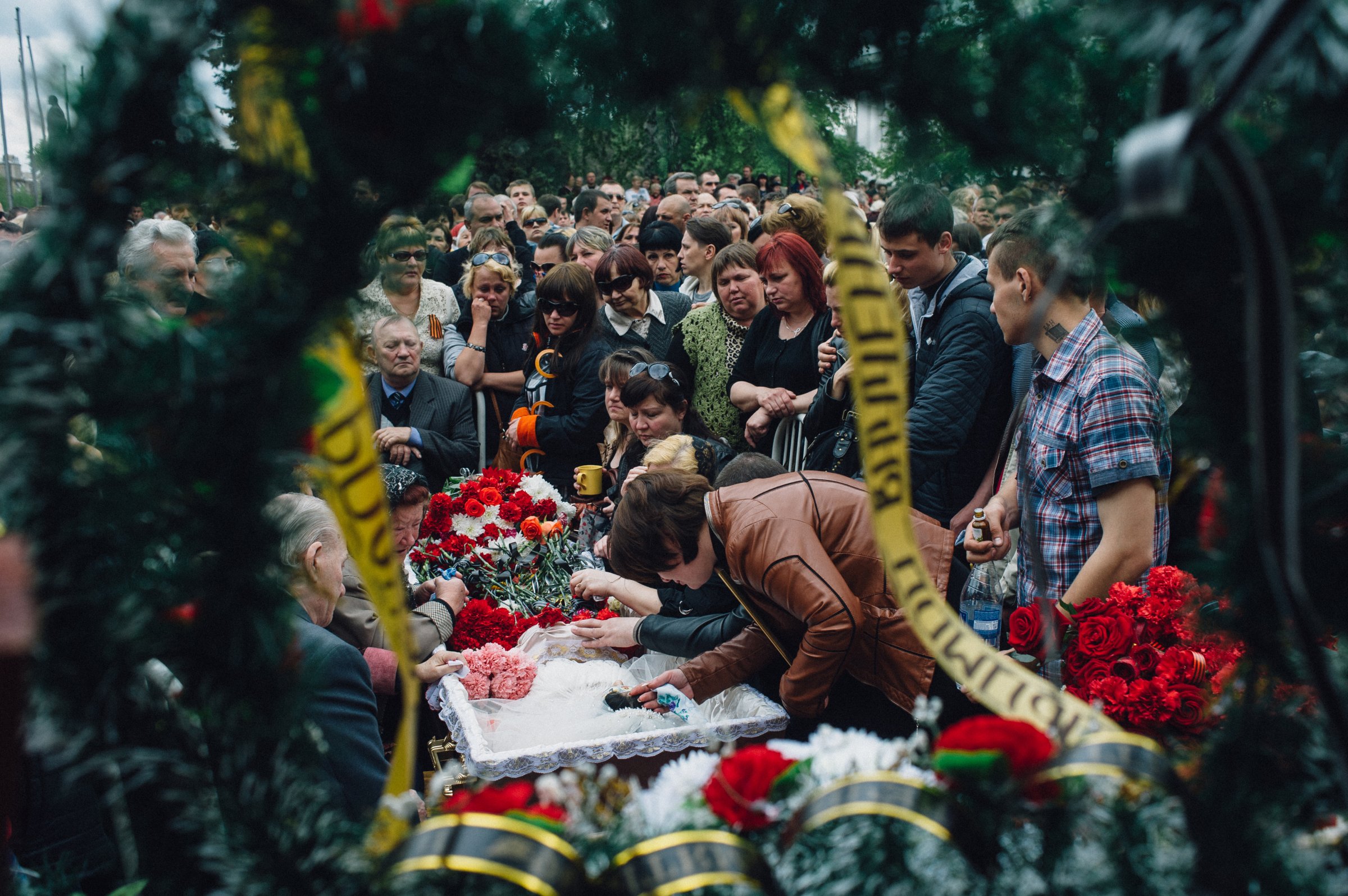 Kramatorsk, Ukraine. May 5, 2014. A funeral of a young girl age 21, Yulia Izotova in the central square in Kramatorsk. Witnesses say she was killed by shots from a Ukrainian military column on the road from Slaviansk to Kramatorsk, Kramatorsk, Maxim Dondyuk for TIME