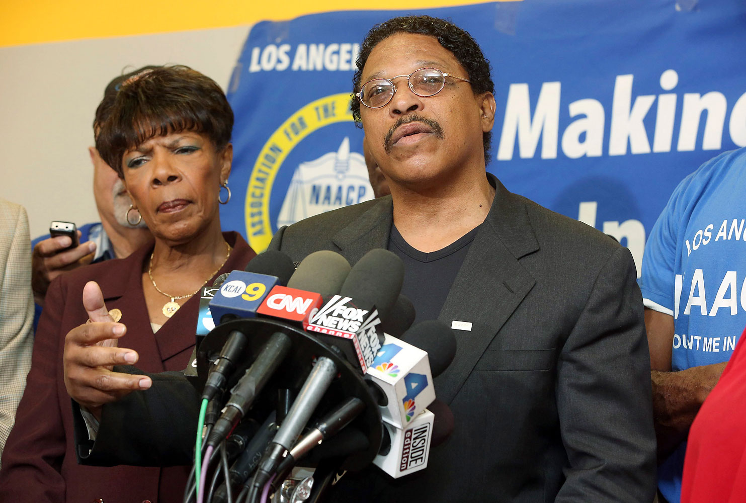 Leon Jenkins, right, president of the Los Angeles chapter of the NAACP, announces that Los Angeles Clippers owner Donald Sterling will not be receiving his lifetime achievement award, at a news conference in Culver City, Calif., April 28, 2014. 