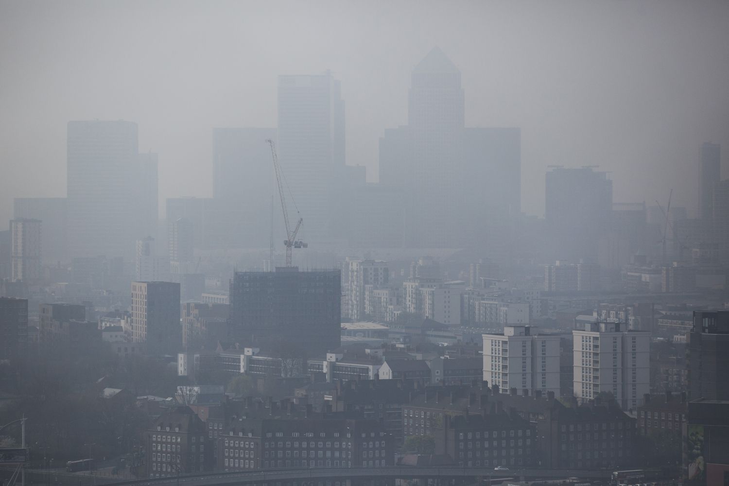 A general view through smog of the Canary Wharf financial district on April 2, 2014 in London. (Dan Kitwood—Getty Images)