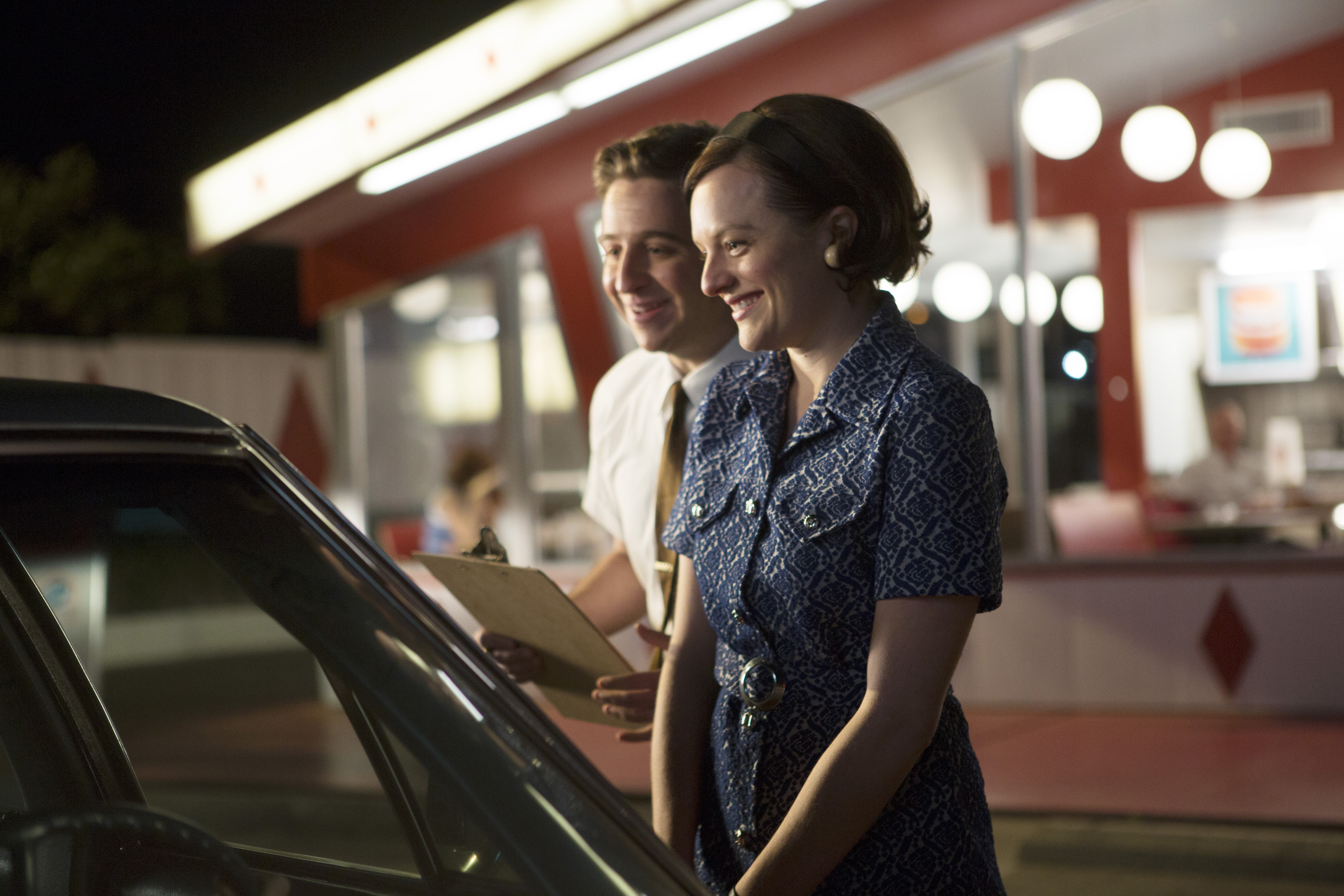 Trevor Einhorn as John Mathis and Elisabeth Moss as Peggy Olson in Mad Men: Burger Chef.