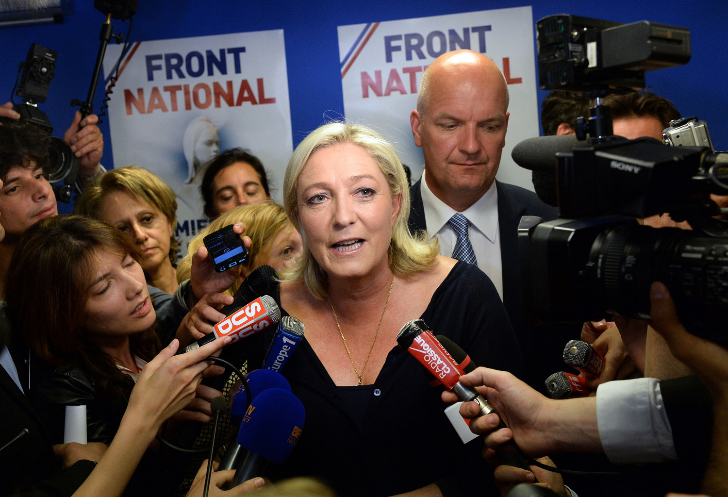 French far-right National Front party president Marine Le Pen reacts at the party's headquarters in Nanterre, outside Paris, on May 25, 2014. (Pierre Andrieu—AFP/Getty Images)