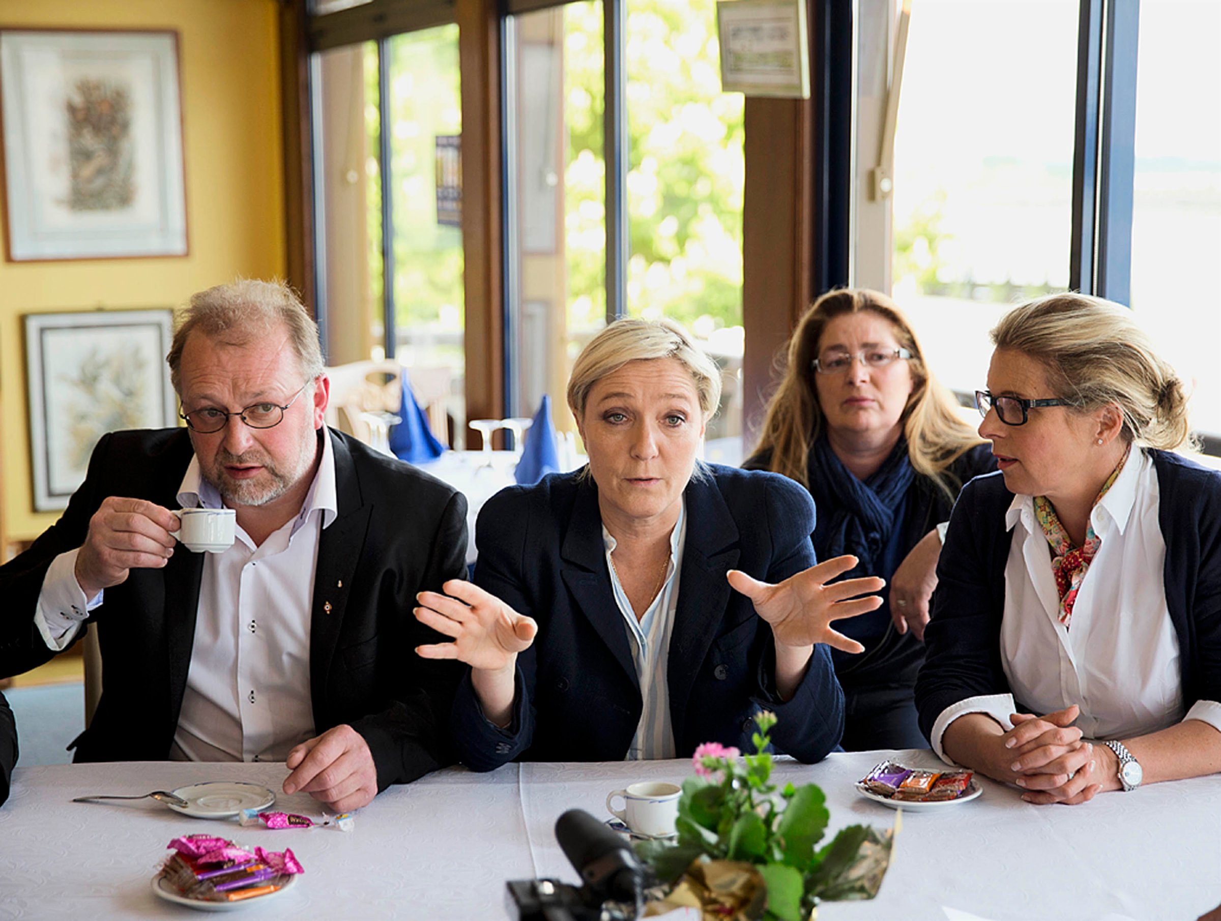 Marine Le Pen meets with the press after doing a walk through of the town of  Abbeville, France , April 28th, 2014.  Marine Le Pen is a French political leader, lawyer by profession, a French politician and the president of the far-right Front National, t