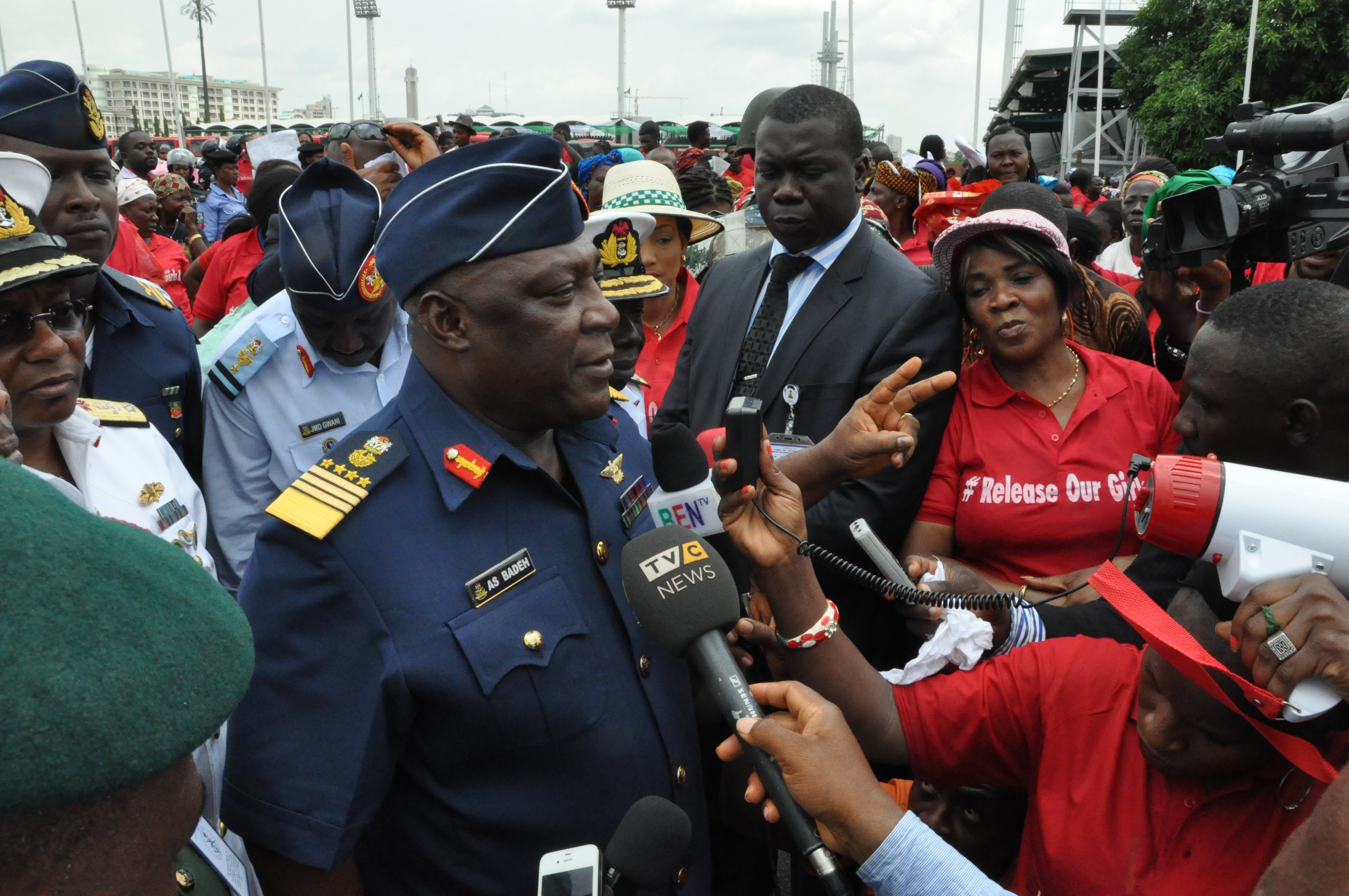 Nigeria defence chief Air Marshal Alex Badeh, center, speaks during a demonstration calling on the government to rescue the kidnapped schoolgirls on May 26, 2014, in the Nigerian capital, Abuja (Gbenga Olamikan—AP)