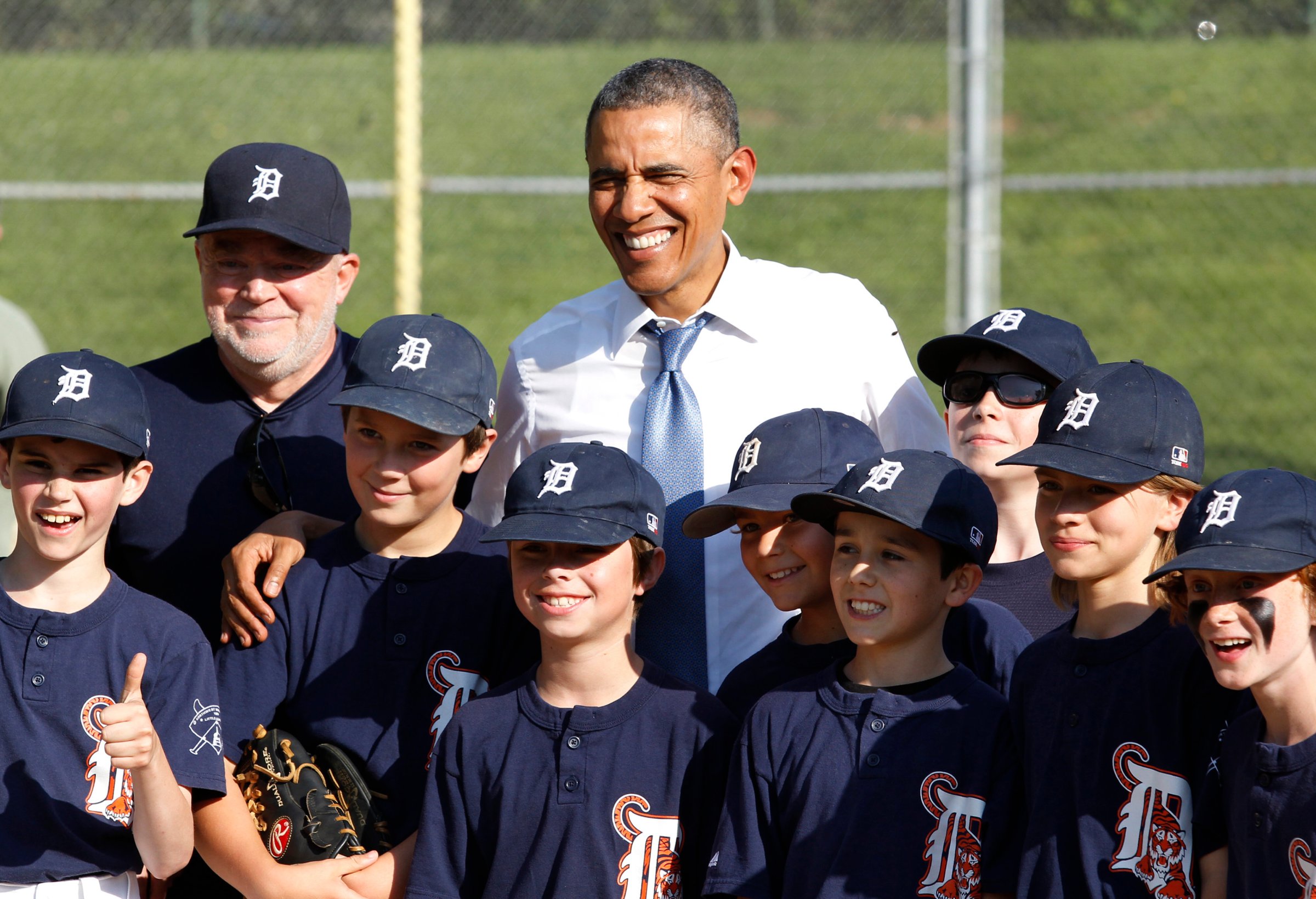 U.S. President Barack Obama poses with Little League baseball players and their coach at Friendship Park in Washington