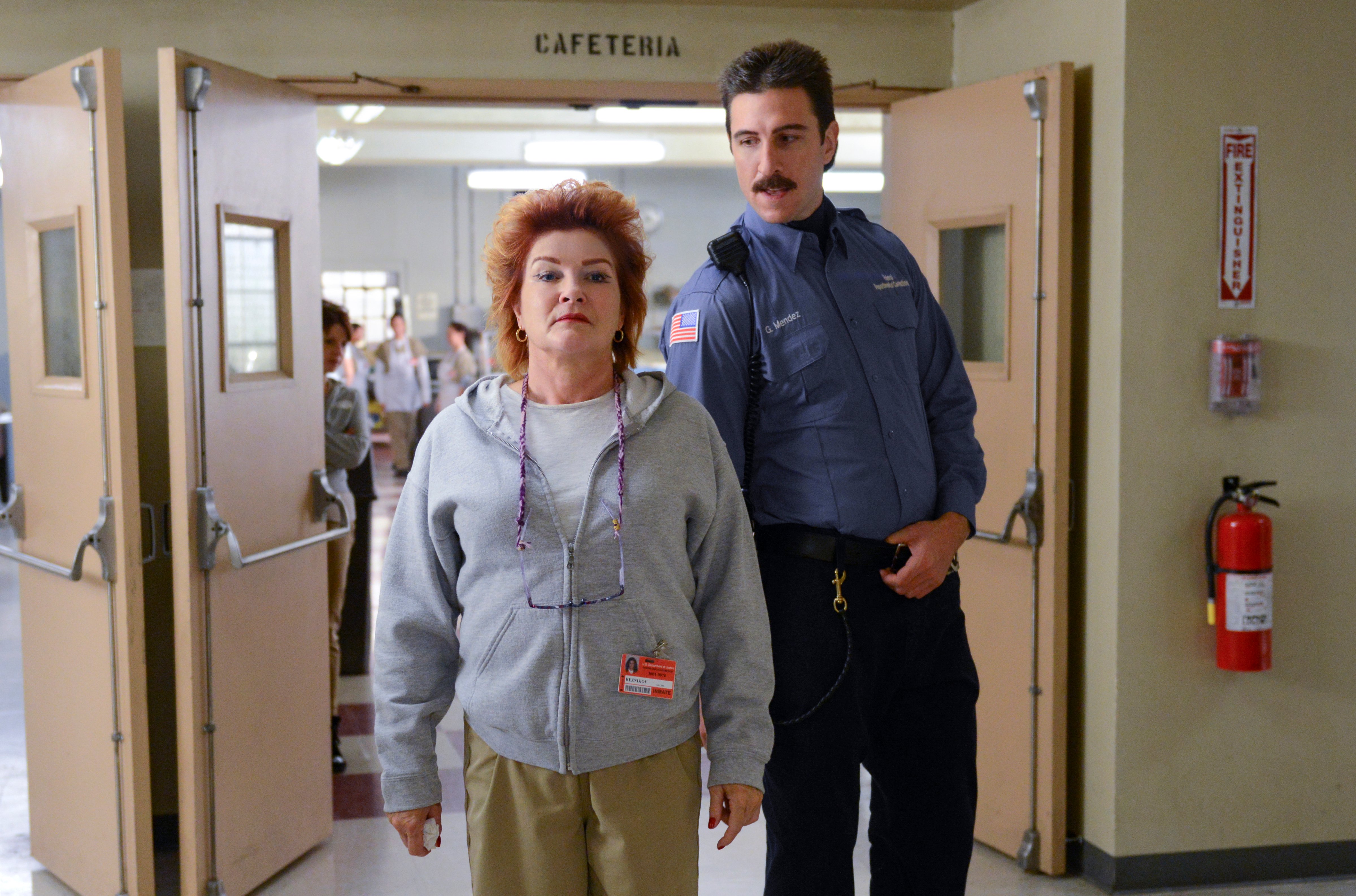 Kate Mulgrew (L) and Pablo Schreiber (R) in a scene from Netflix’s “Orange is the New Black” Season 2. (Ali Goldstein—Netflix)