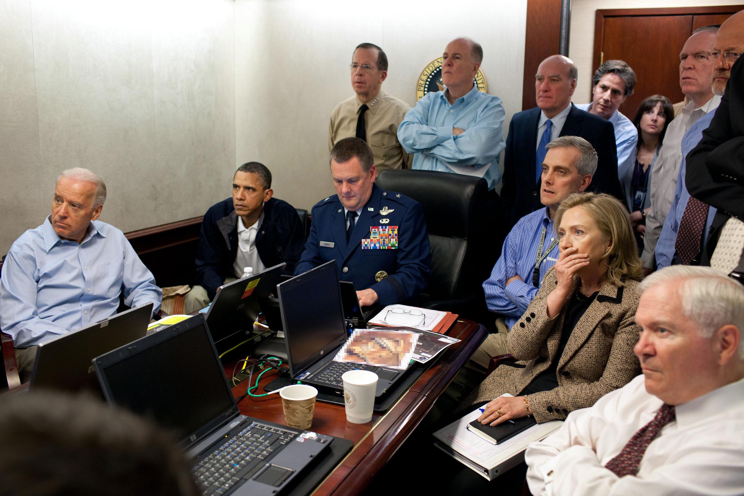 President Barack Obama, Vice President Joe Biden and former Secretary of State Hillary Clinton, along with with members of the national security team, receive an update on the mission against Osama bin Laden in the Situation Room of the White House in Washington, D.C., on May 1, 2011.