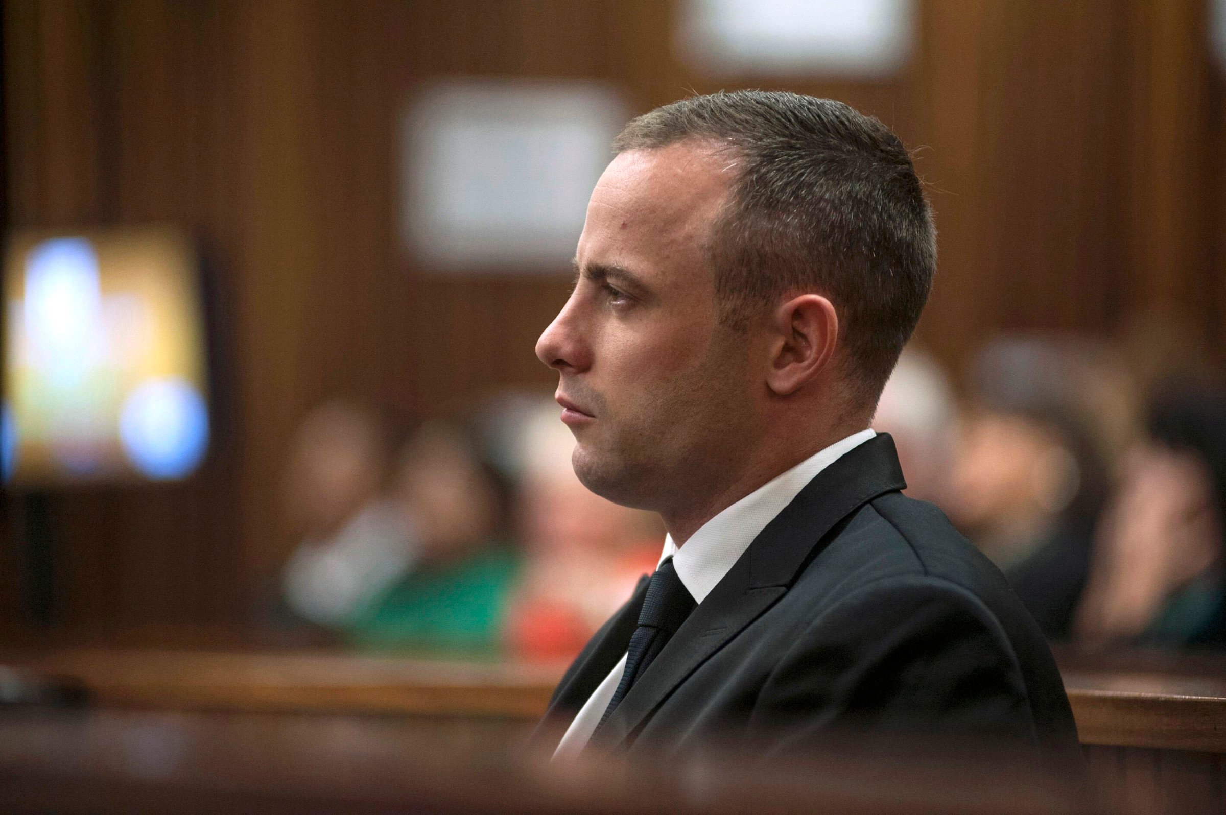 Olympic and Paralympic track star Oscar Pistorius sits in the dock in the North Gauteng High Court in Pretoria May 5, 2014.