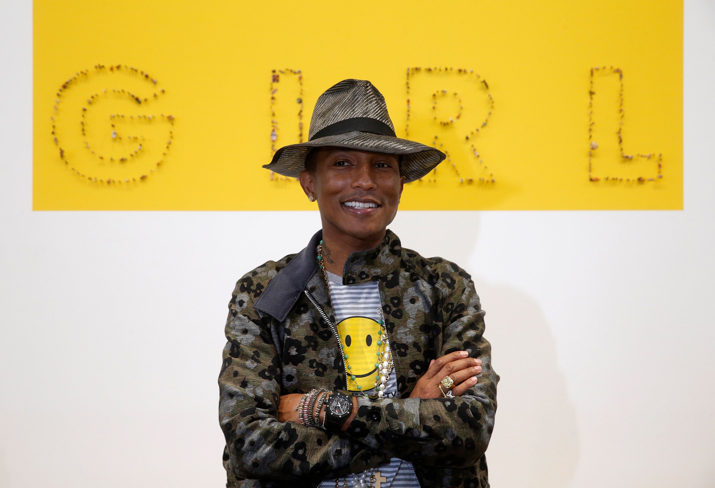 Singer Pharrell Williams poses during the opening of the exhibition "GIRL" at the Galerie Perrotin in Paris
