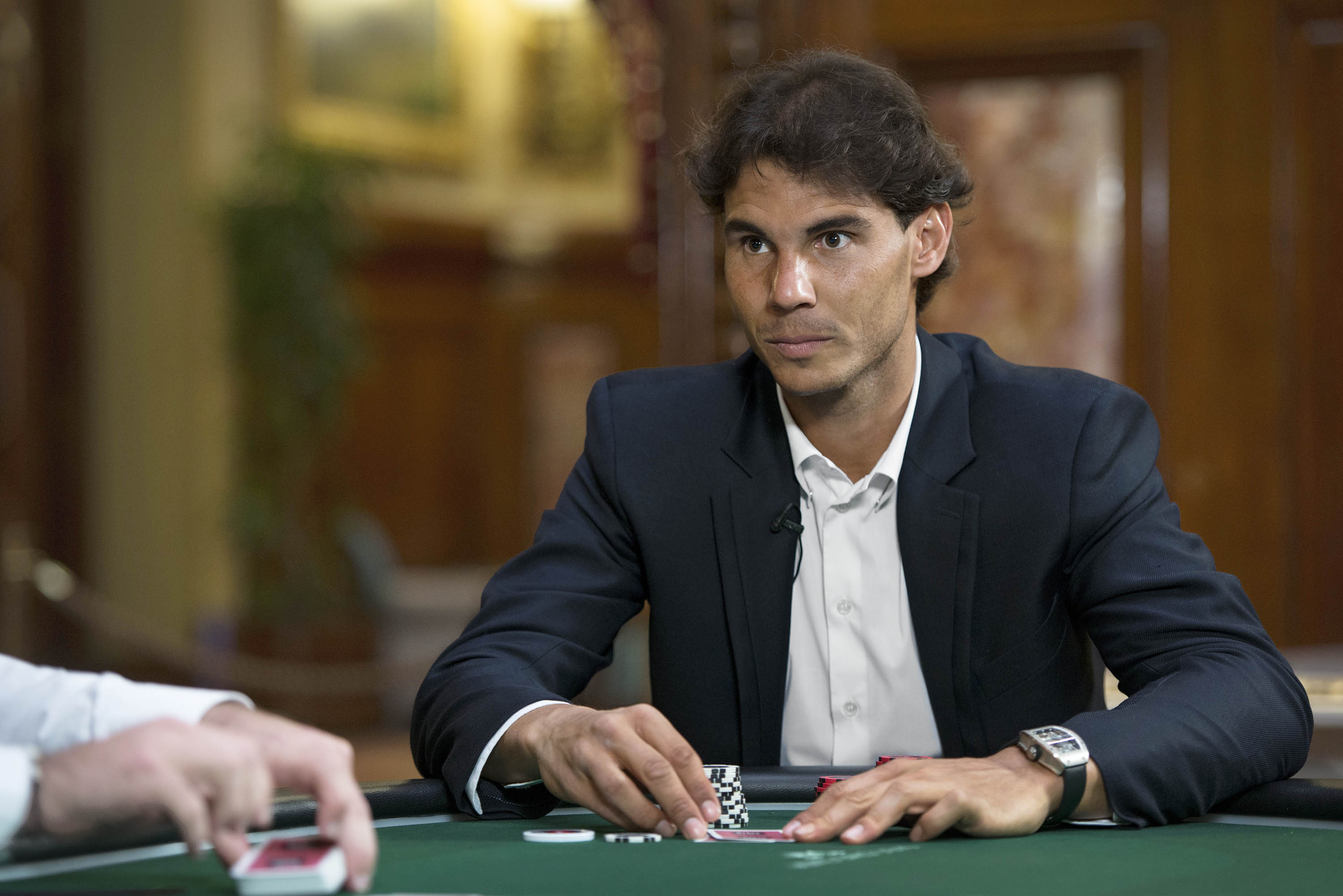 Rafael Nadal, one of the world's top tennis pros, plays poker against one of the world’s best female poker players, Vanessa Selbst, at the Casino de Monte Carlo in Monaco on Fri April 11, 2014. (Joachim Ladefoged—VII for TIME)