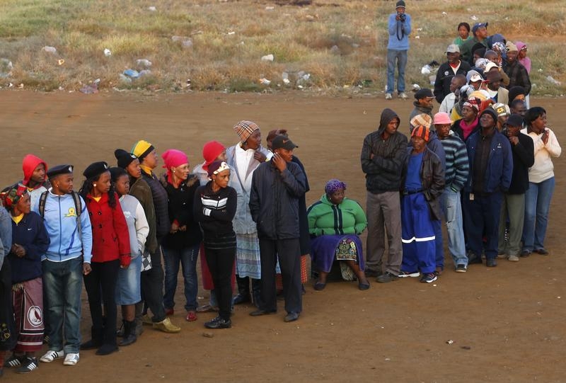 Voters queue to cast their ballots in Bekkersdal near Johannesburg
