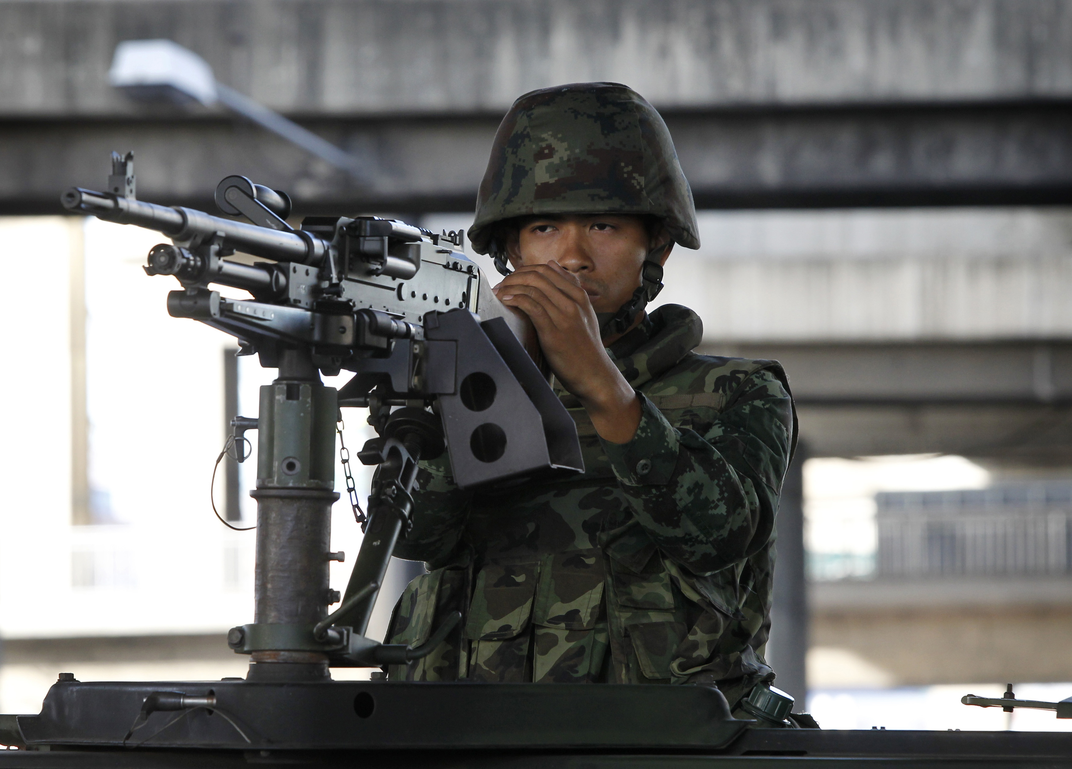 A Thai soldier mans a machine gun in central Bangkok