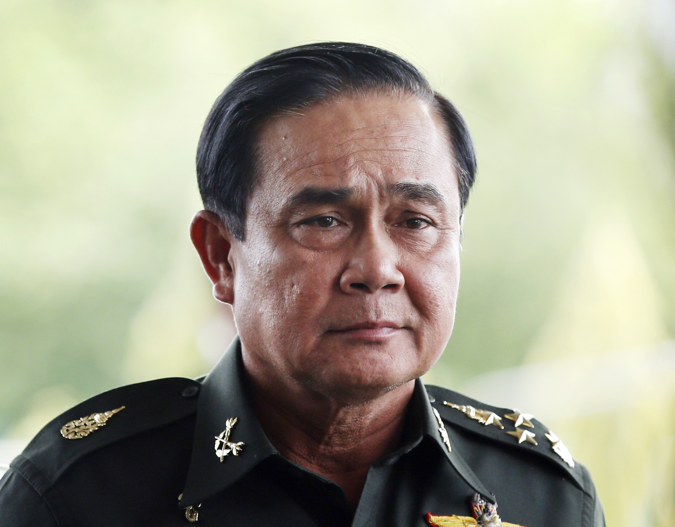 Thai army chief General Prayuth Chan-ocha arrives to give a news conference at the Army Club in Bangkok on May 20, 2014 (Athit Perawongmetha—Reuters)