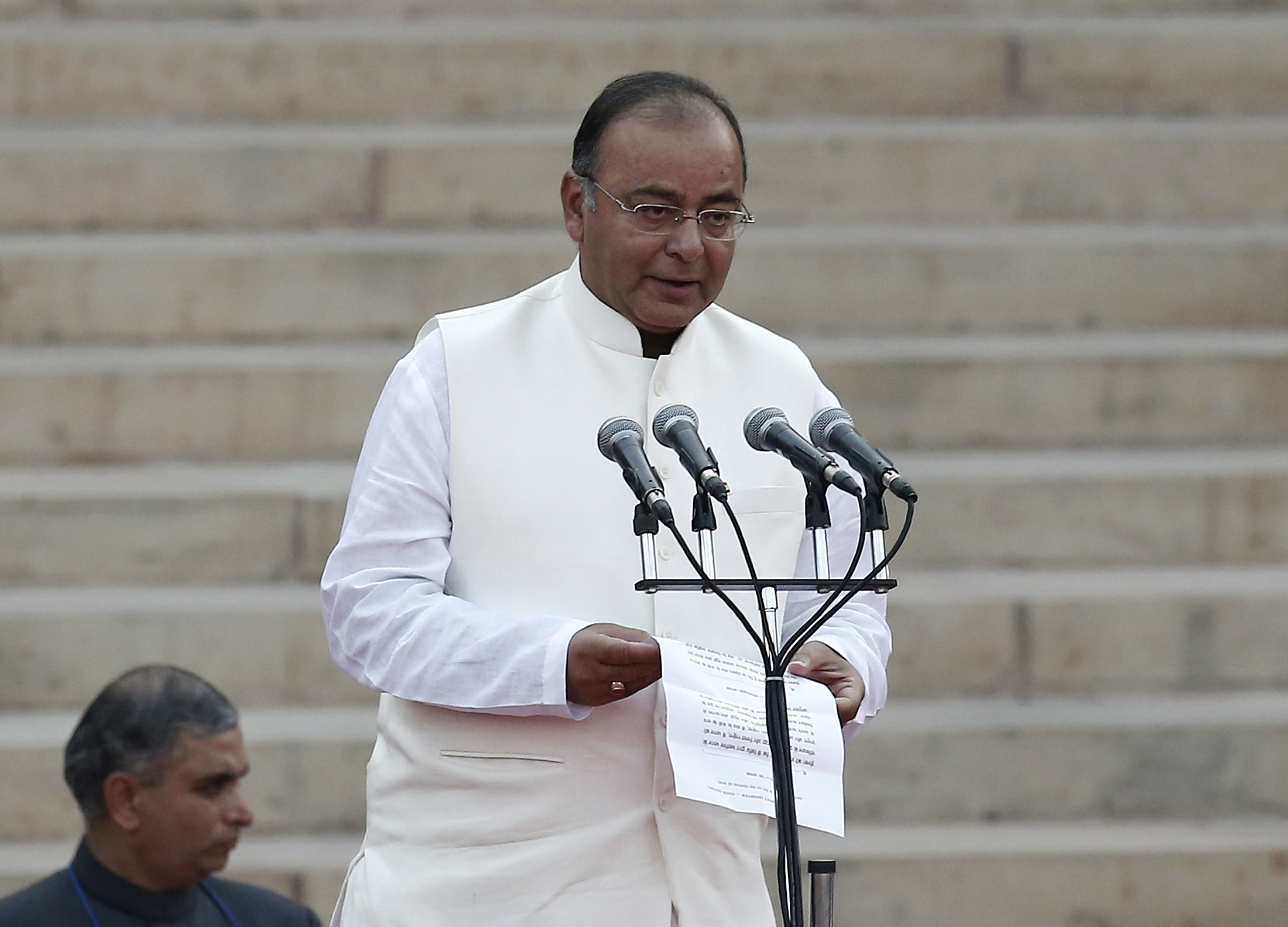Arun Jaitley takes the oath of office as the country's new Finance Minister at the presidential palace in New Delhi on May 26, 2014 (Adnan Abidi/Reuters—Reuters)