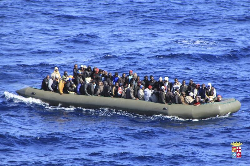 Migrants are seen in a boat after being rescued by an Italian navy ship on Feb. 5, 2014. Two boats carrying migrants capsized south of Italy in recent days (Reuters)