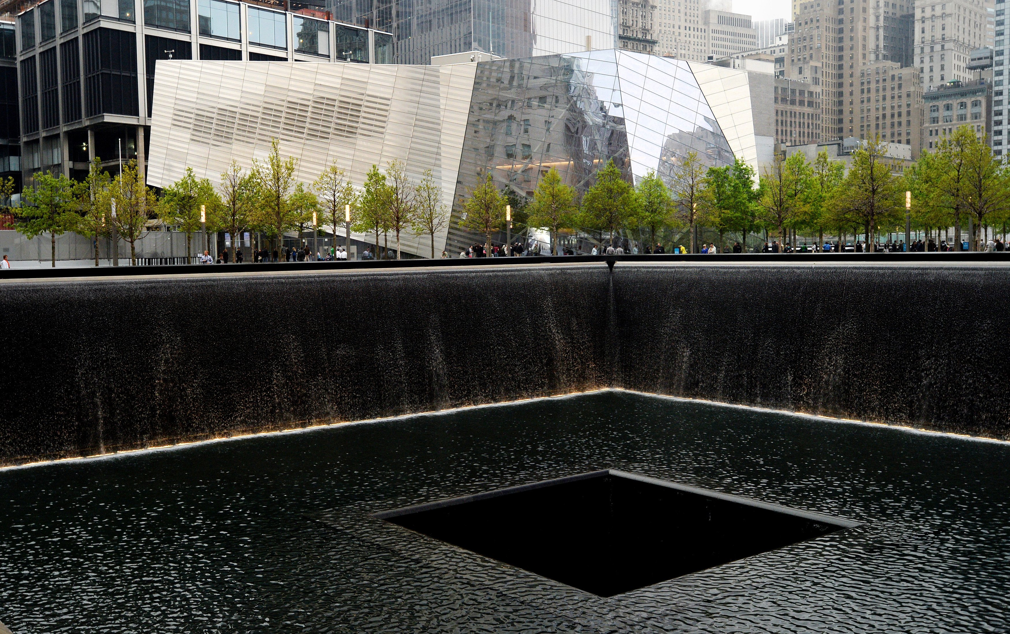 A view of the National September 11 Memorial Museum with the north reflecting pool in foreground during the museum's dedication ceremony on May 15, 2014 in New York City. (Justin Lane—AP)