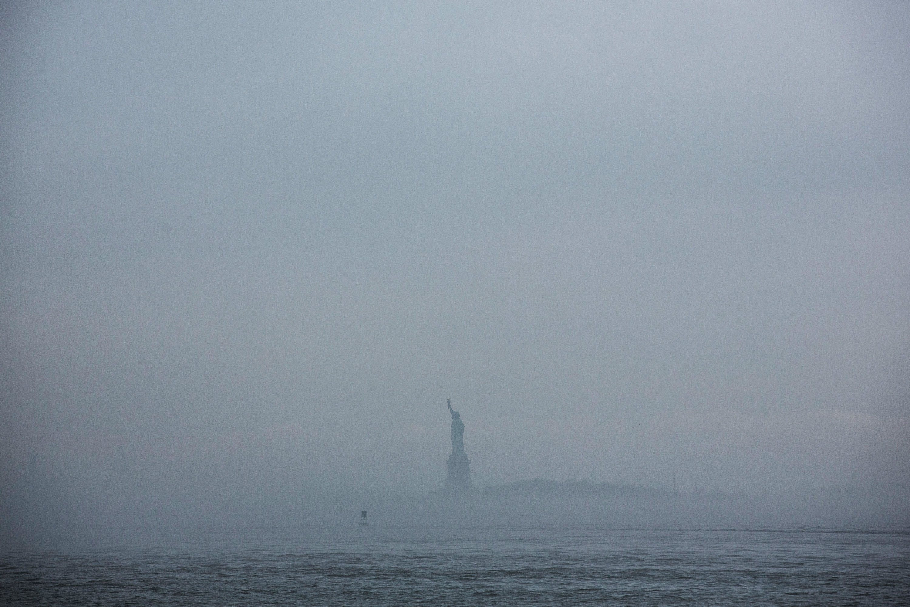 The Statue of Liberty is enveloped in fog on May 1, 2014. (Andrew Burton—Getty Images)