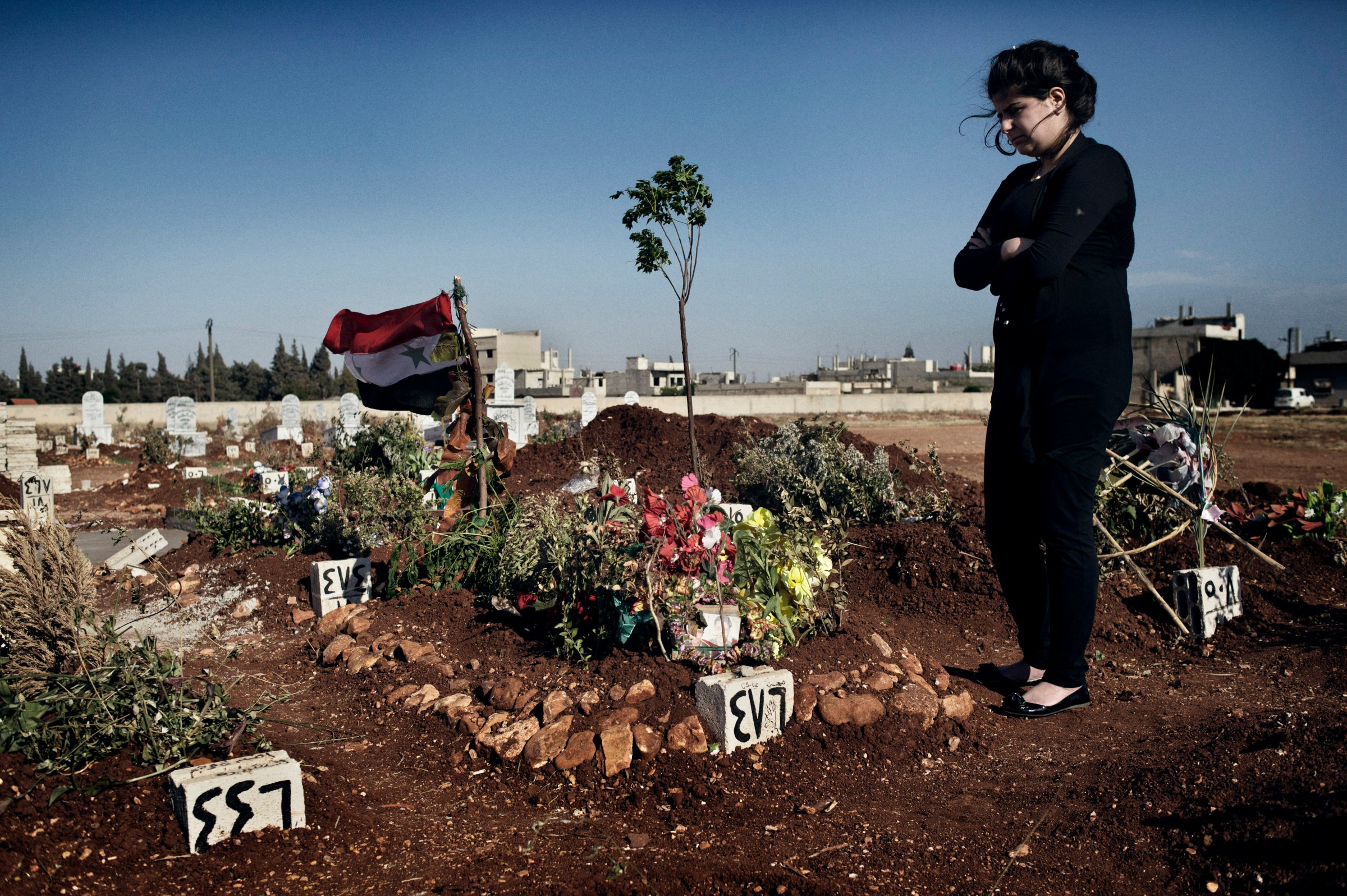 Rashan, 17, buried her husband of five months in the Martyrs of Firdous Cemetery, Zahara neighborhood, Homs.