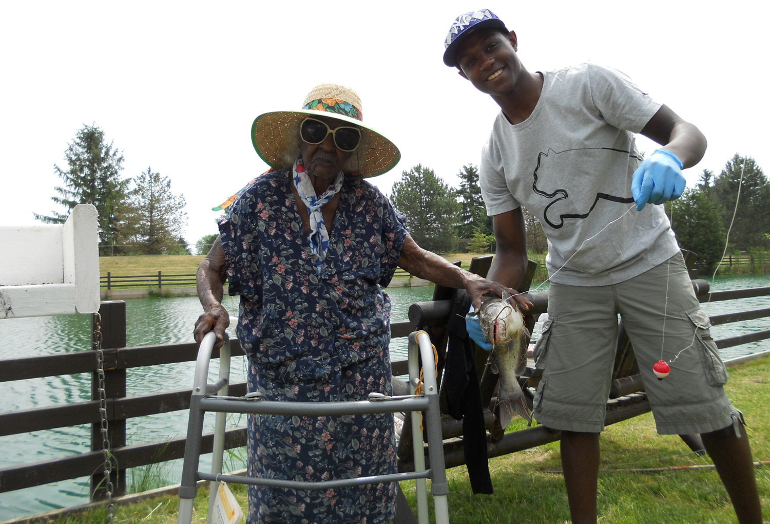 Jeralean Talley and godson Tyler Kinloch pictured with one of the seven catfish she caught at the Spring Valley Trout Farm in Dexter, Mich., on June 16, 2012. (Courtesy of Michael Kinloch)
