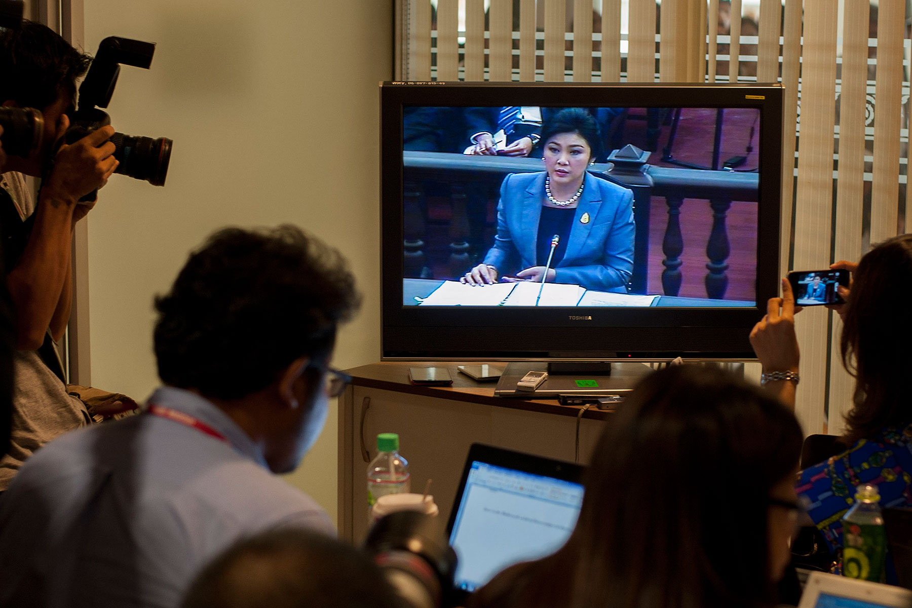 Thai Prime Minister Yingluck Shinawatra is seen on a TV during her statement at the Constitutional Court on May 6, 2014, in Bangkok (Sanchez Trillo—Getty Images)