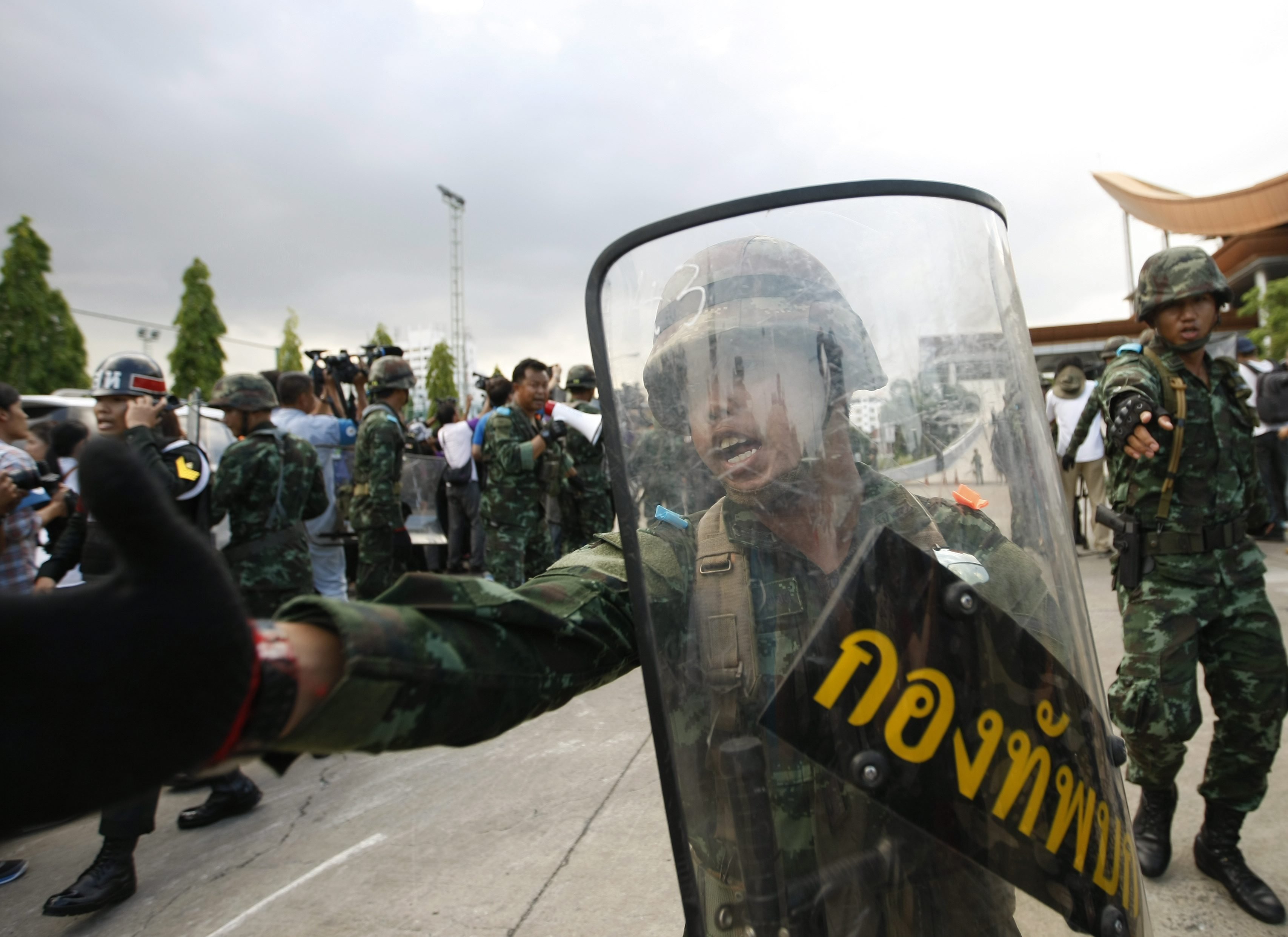 Thai armed soldiers stand guard after they used a military truck to block the entrance of the Army Club following a military coup in Bangkok on May 22, 2014. (Pongmanat Tasiri—EPA)
