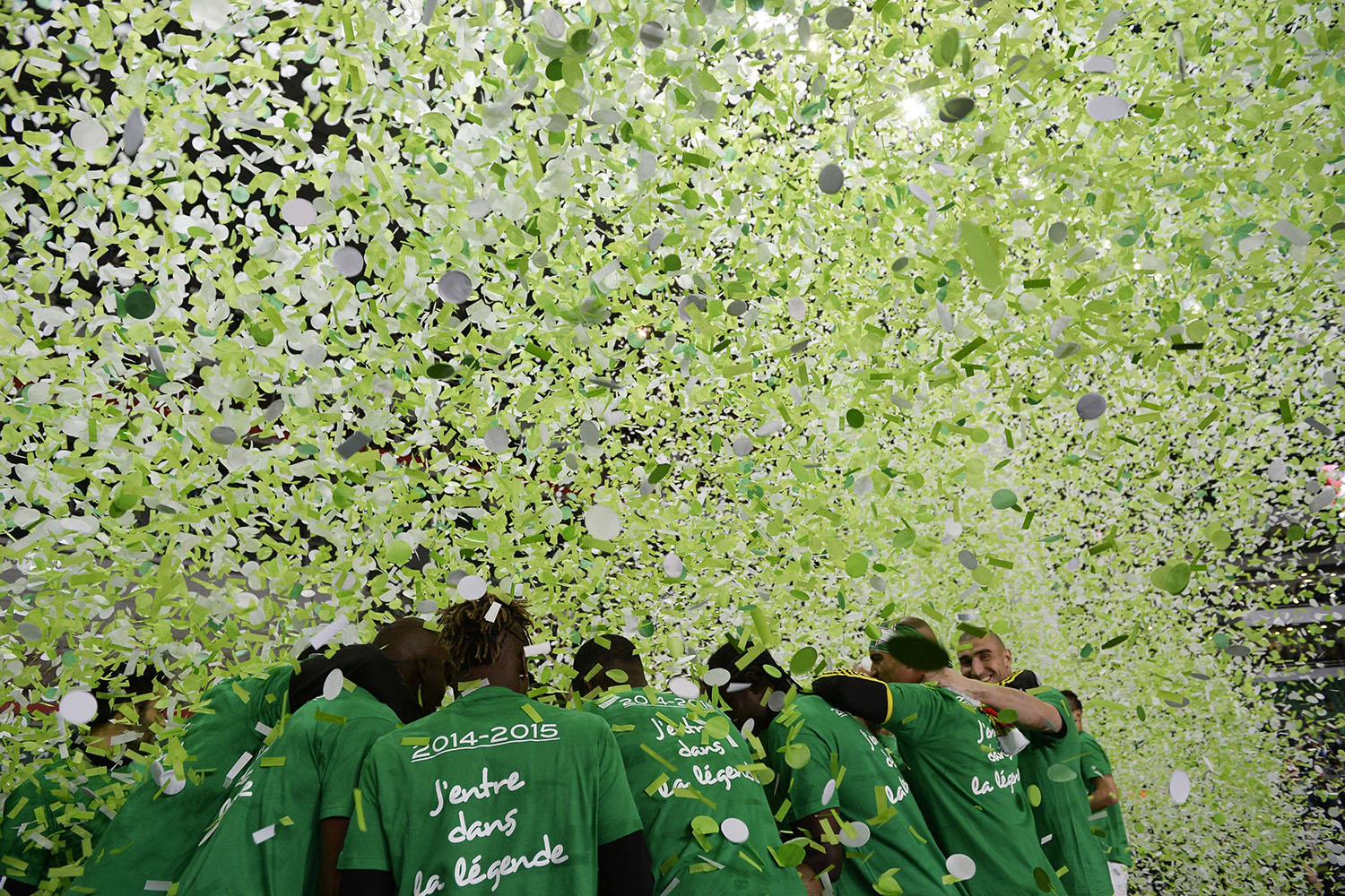 Saint-Etienne's players celebrate victory at the end of the French League football match between Saint-Etienne and Ajaccio, at the Geoffroy Guichard stadium in Saint-Etienne, central France, on May 18, 2014.