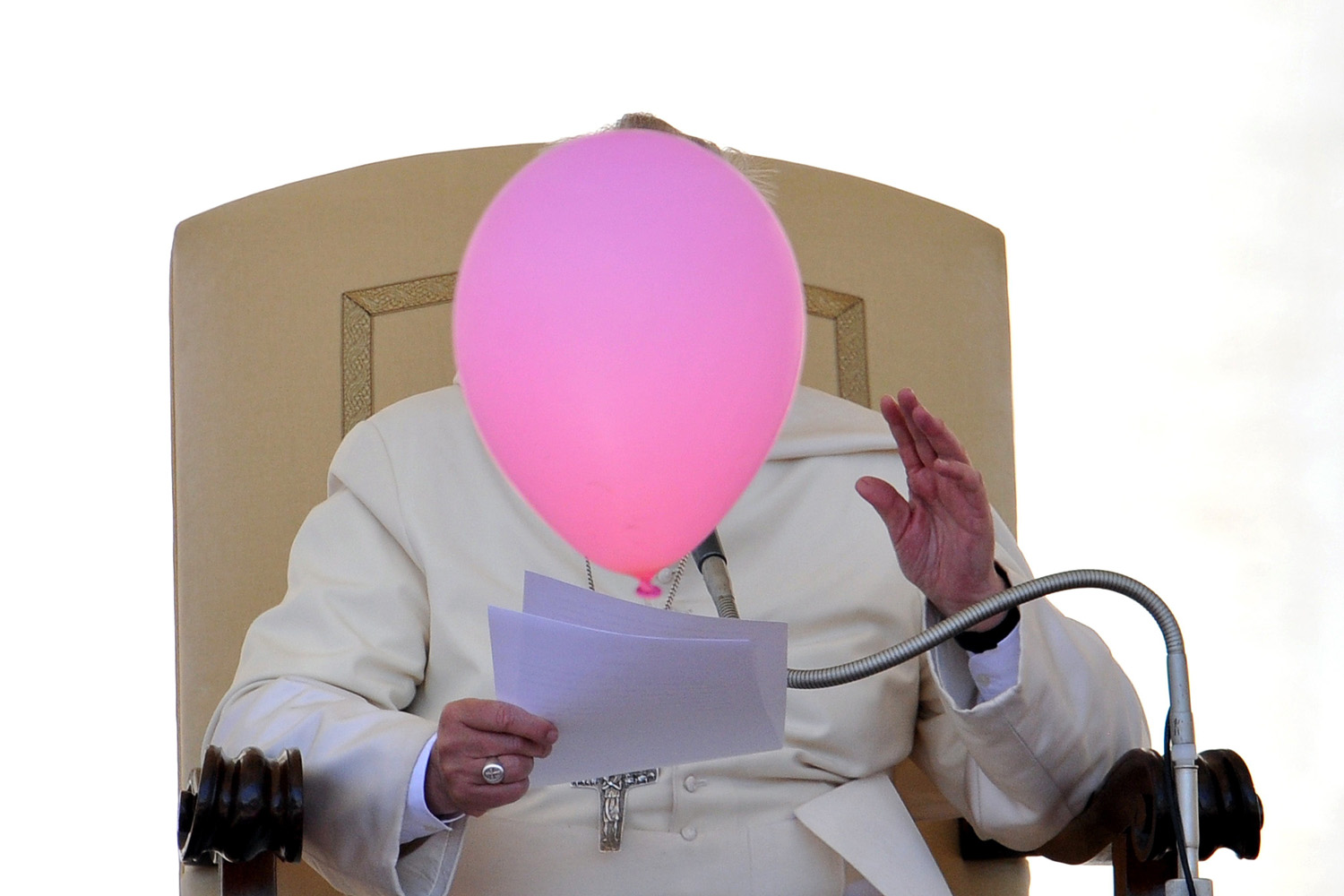 A balloon flies past Pope Francis during his general audience in St. Peter's Square at the Vatican on May 14, 2014.